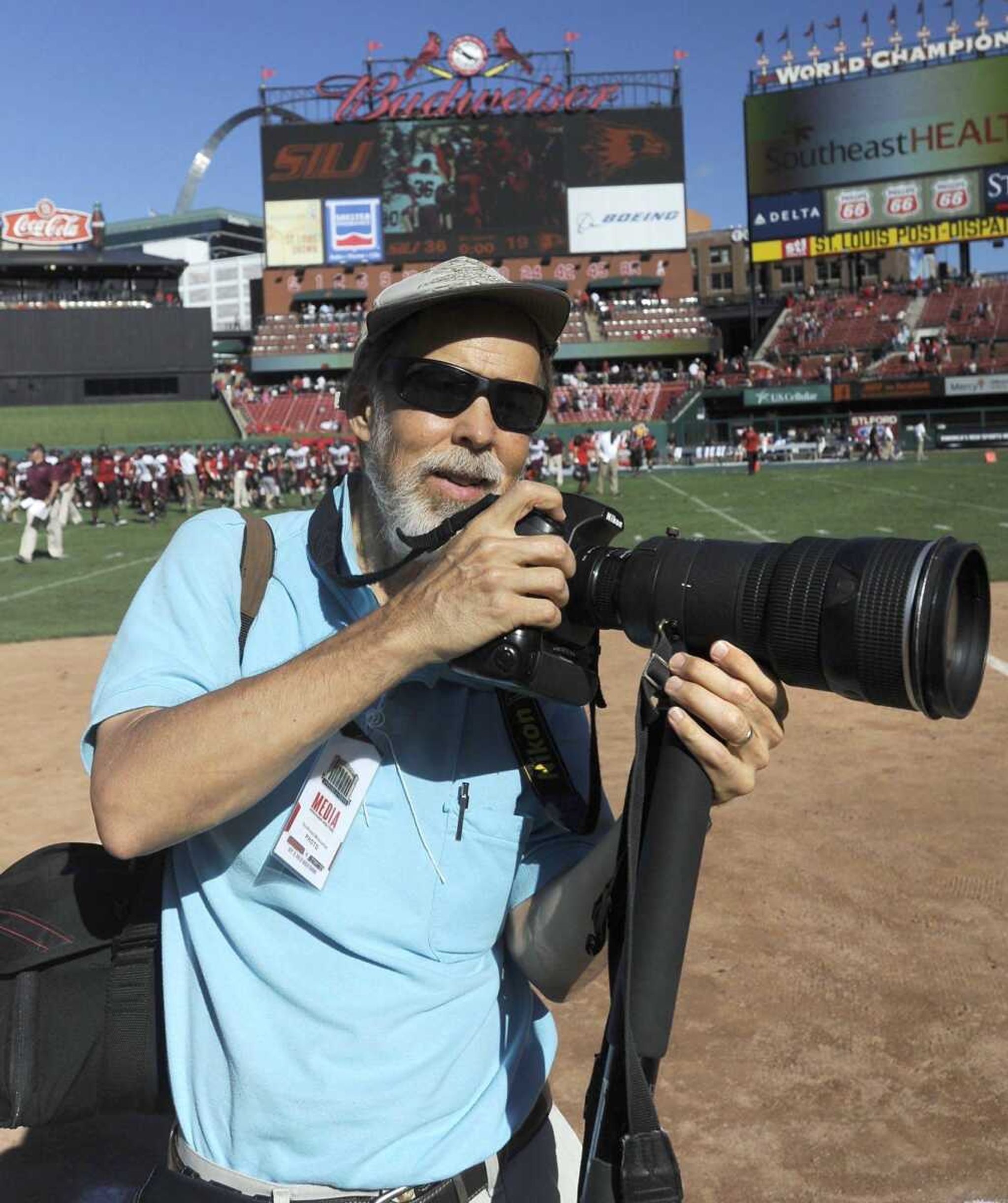 Southeast Missourian photographer Fred Lynch poses for a photo after covering the College Classic rivalry football game with Southeast Missouri State and Southern Illinois University-Carbondale on Sept. 21, 2013, at Busch Stadium in St. Louis. It was the first-ever football game held at Busch. SIU won 36-19.