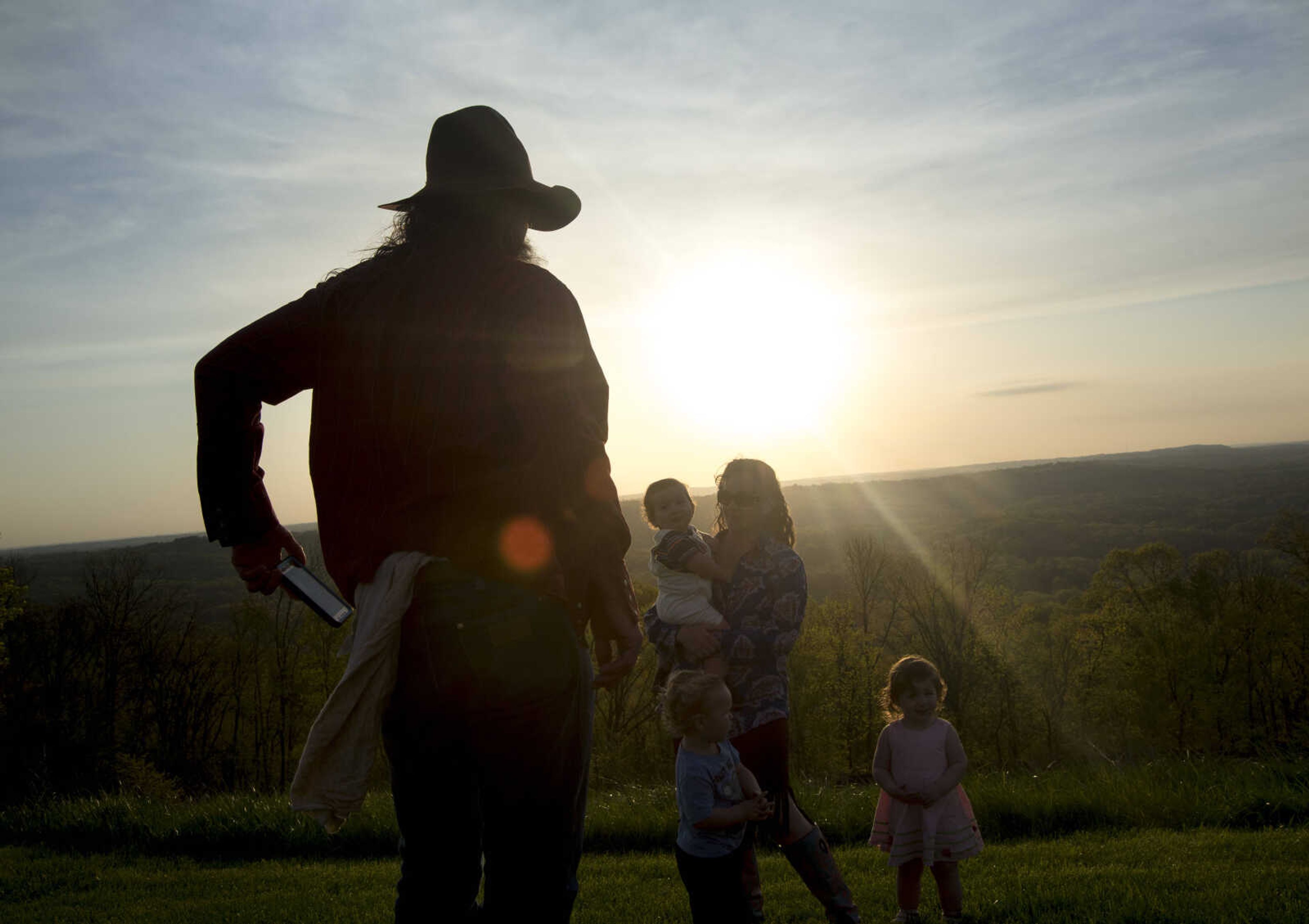 Chris Powers takes a photo of his family during the 81st annual Easter Sunrise Service at the Bald Knob Cross of Peace Sunday, April 16, 2017 in Alto Pass, Illinois.