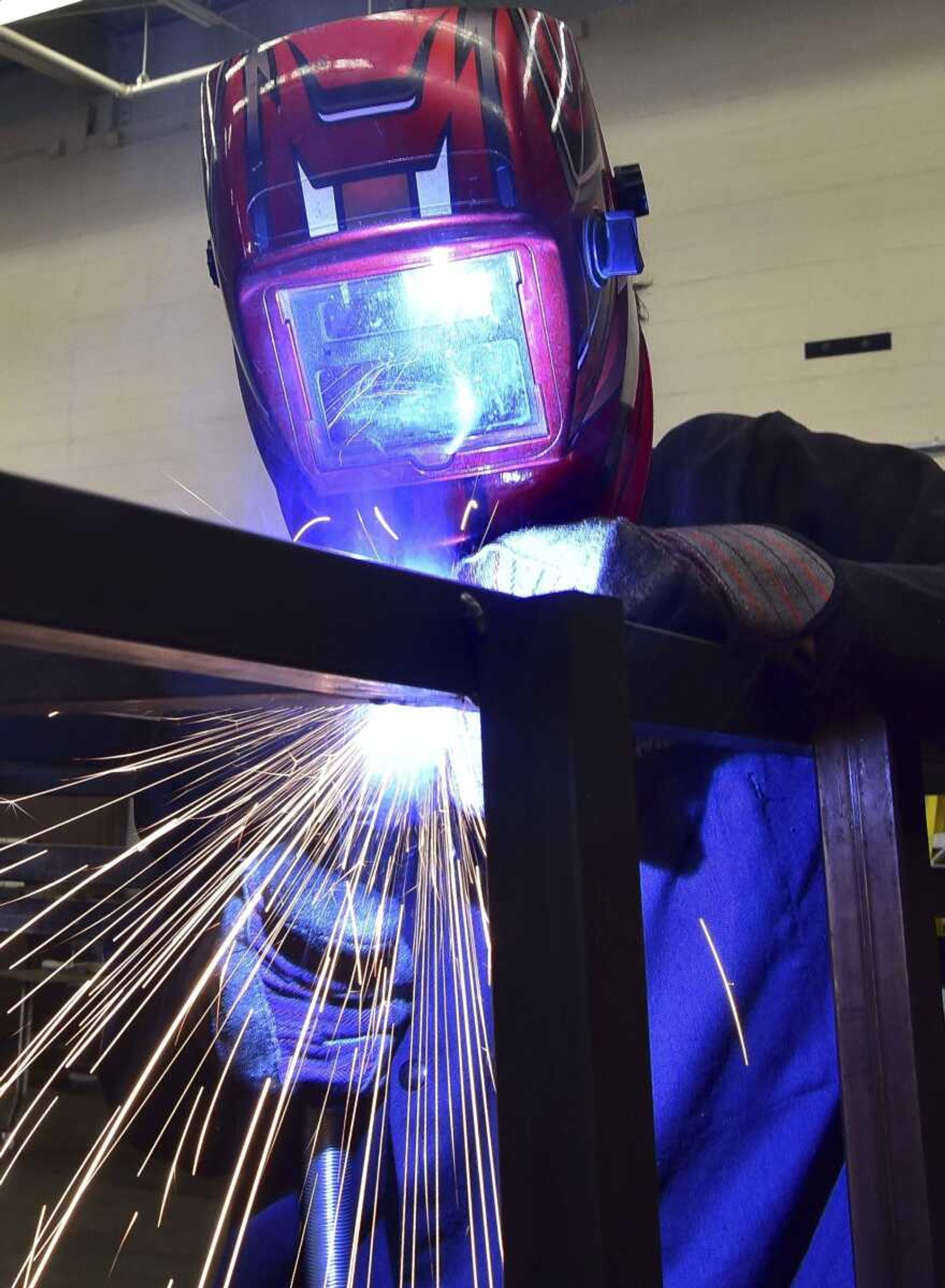 Dalton Scott, 17, welds together metal for a deer blind accessible to hunters with disabilities Tuesday at the Cape Girardeau Career and Technology Center.