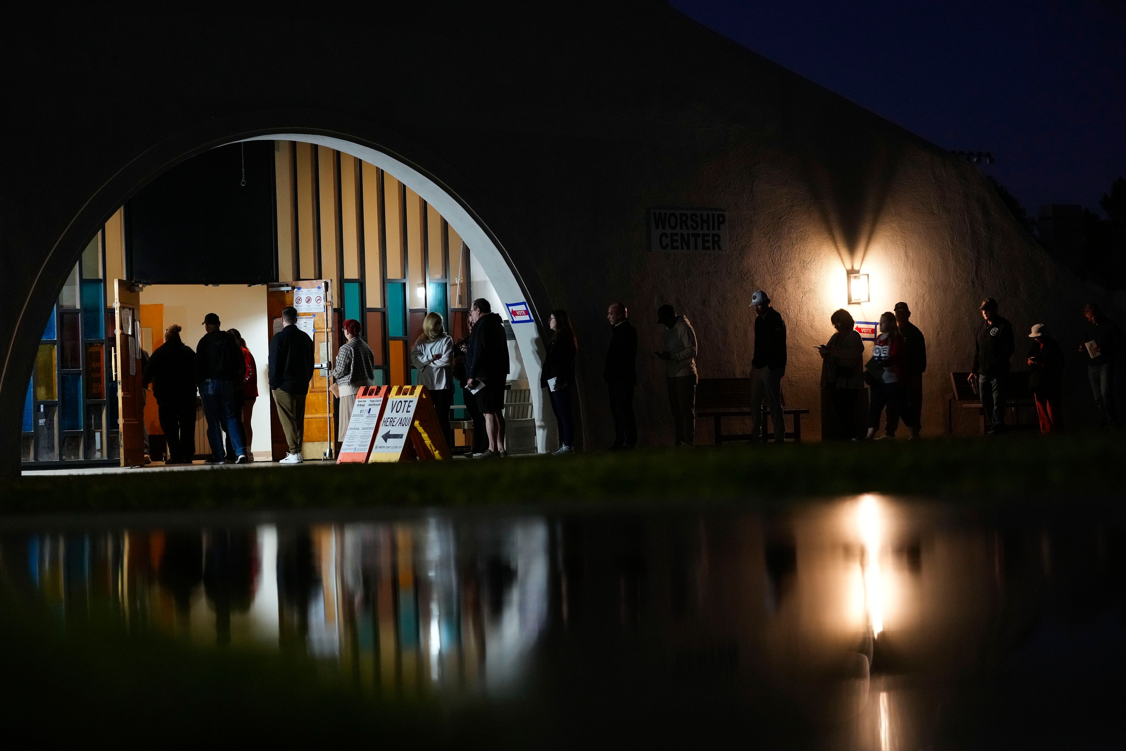 Voters stand in line outside a polling place at Madison Church, Tuesday, Nov. 5, 2024, in Phoenix, Ariz. (AP Photo/Matt York)