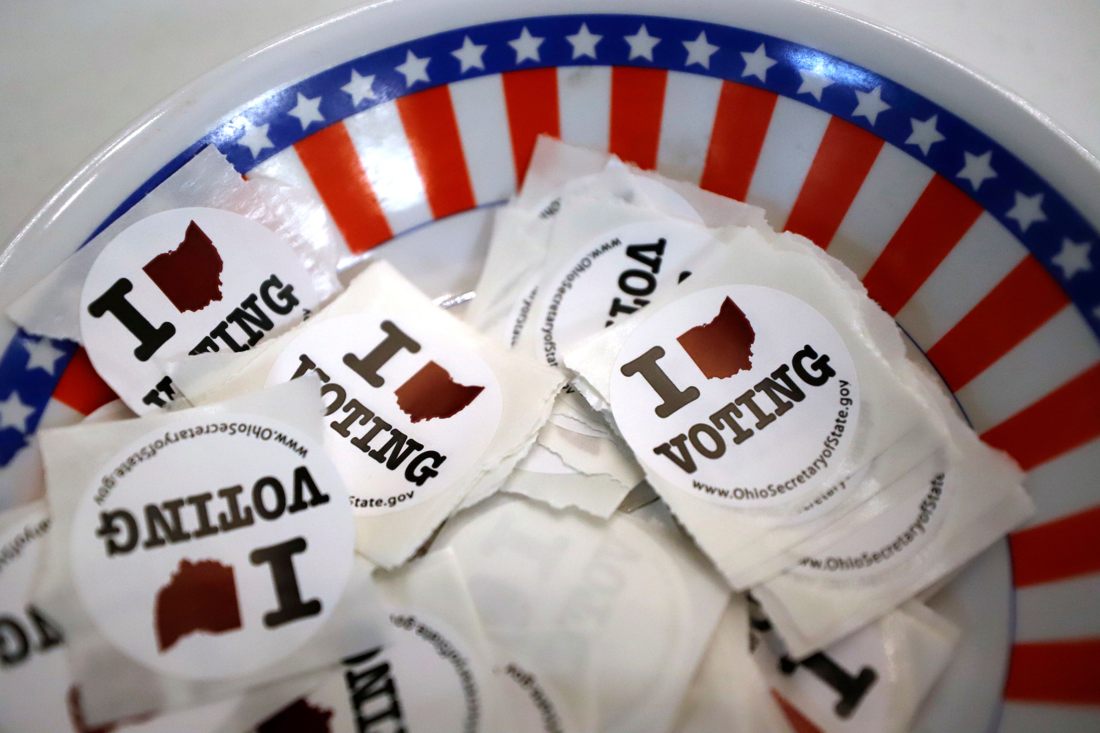 FILE - A bowl of voting stickers for early voters is shown March 15, 2020, in Steubenville, Ohio. (AP Photo/Gene J. Puskar, File)