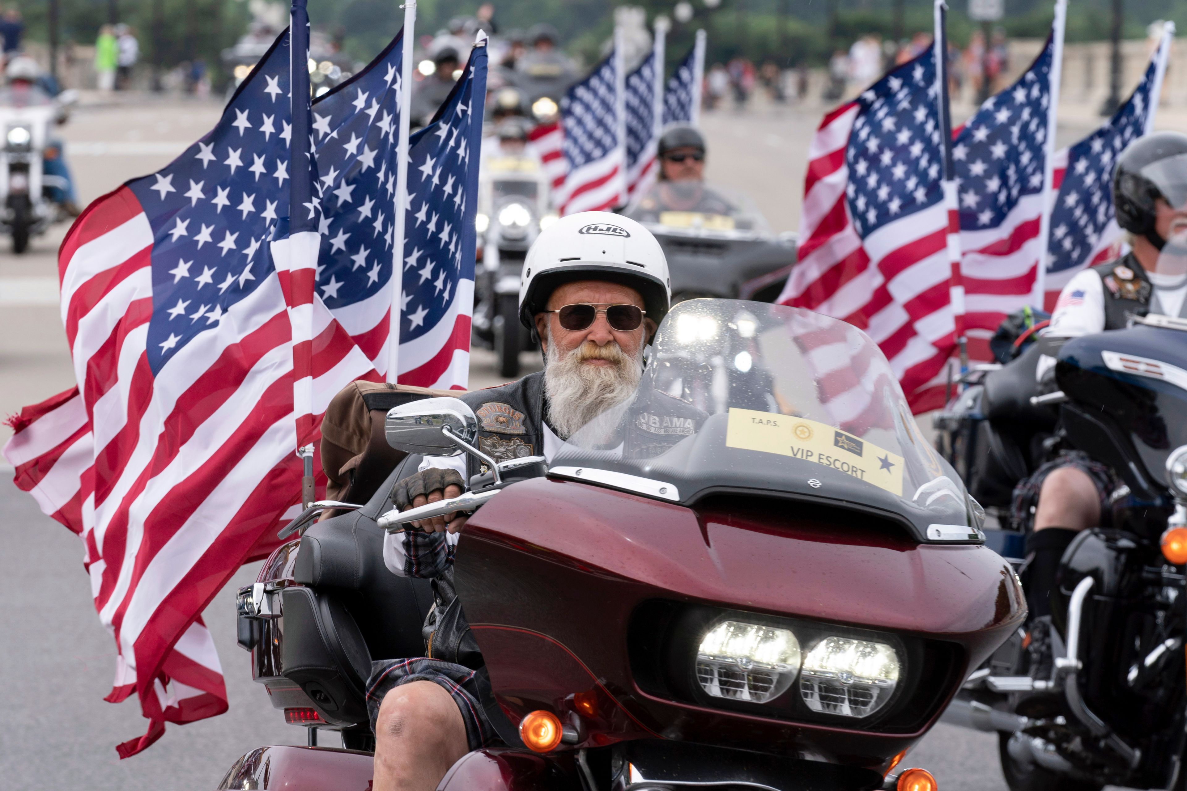 FILE - Participants in the "Rolling to Remember" motorcycle rally ride past Arlington Memorial Bridge during the annual motorcycle parade, ahead of Memorial Day, in Washington, Sunday, May 28, 2023. (AP Photo/Jose Luis Magana, File)