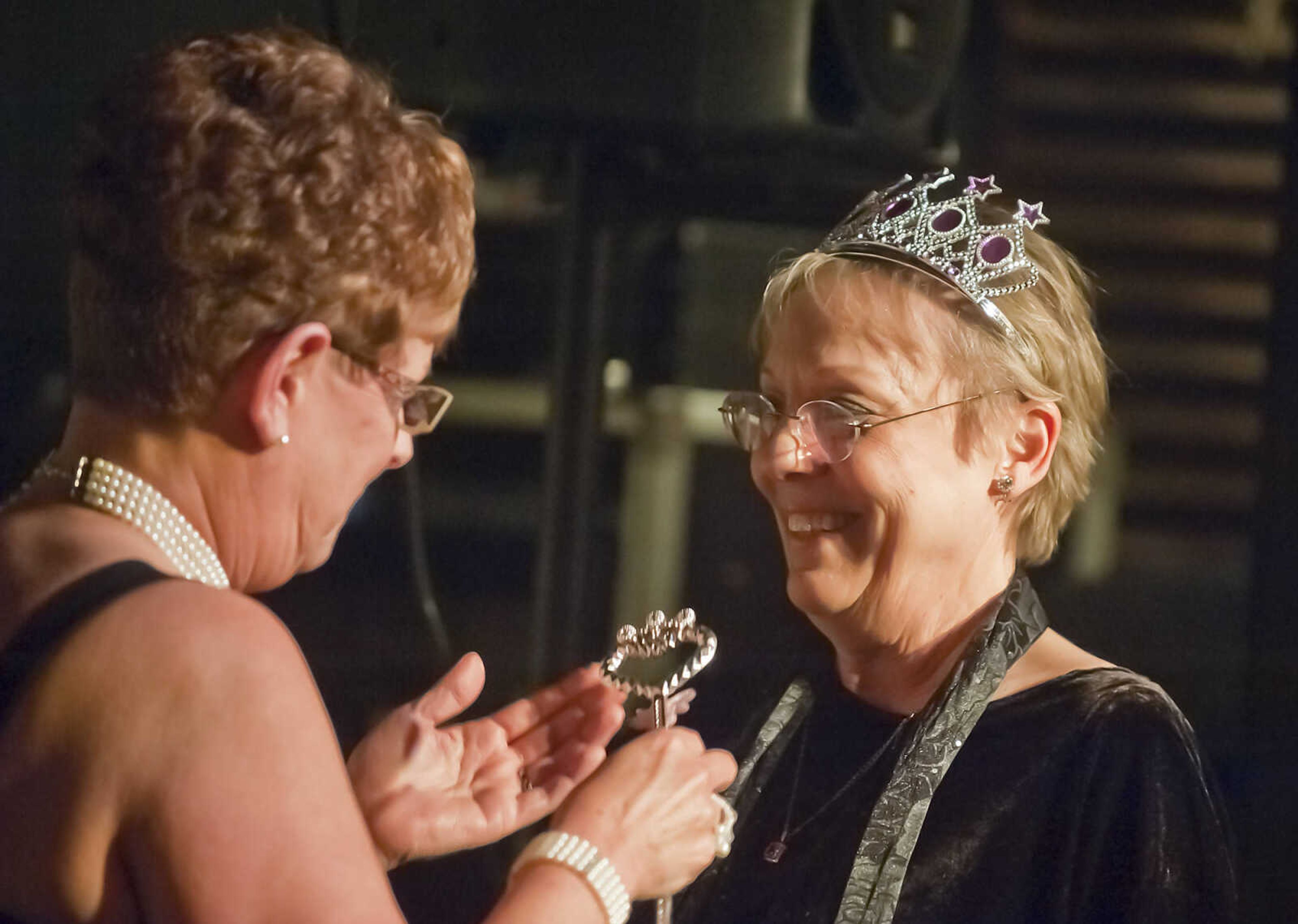 Debbie Barnhouse, left, president of the River City Players' board of directors, presents Roseanna Whitlow-Greenwood  with the Queen of the Theater Award during the Abbott Awards, the River City Players' annual awards ceremony, Saturday, Jan. 18, at Port Cape in downtown Cape Girardeau. Auditions for the first production of the 2014 season, "Quiet on the Set," will be held at 7 p.m. Jan. 29 and 30 at Port Cape.