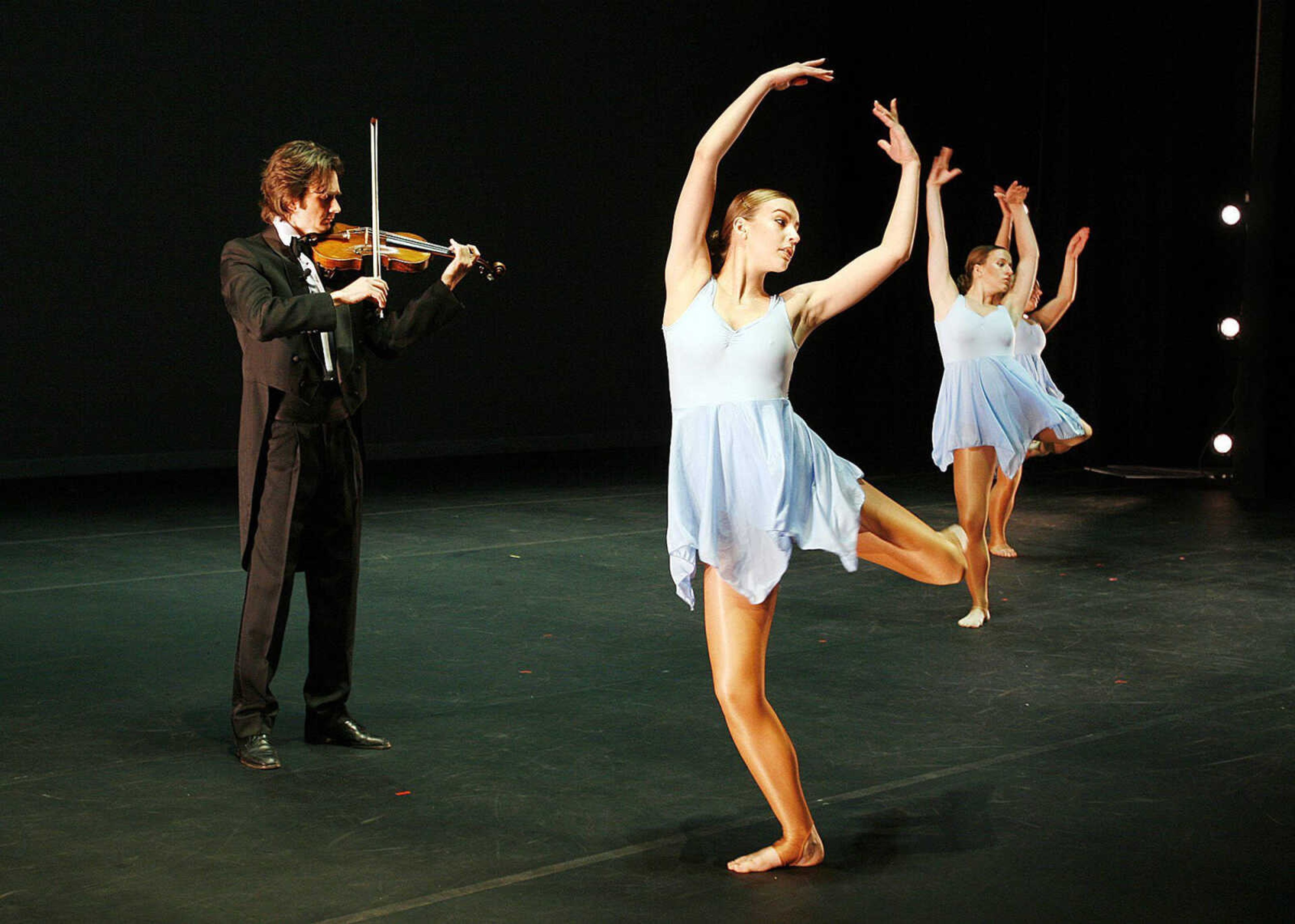 ELIZABETH DODD ~ photos@semissourian.com
Dancers from the Department of Theatre and Dance and violinist Brandon Christensen rehearse a dance called "Sonata for Five in Fours" for Dance-Apalooza on April 15, 2009 in the Bedell Performance Hall at the River Campus.