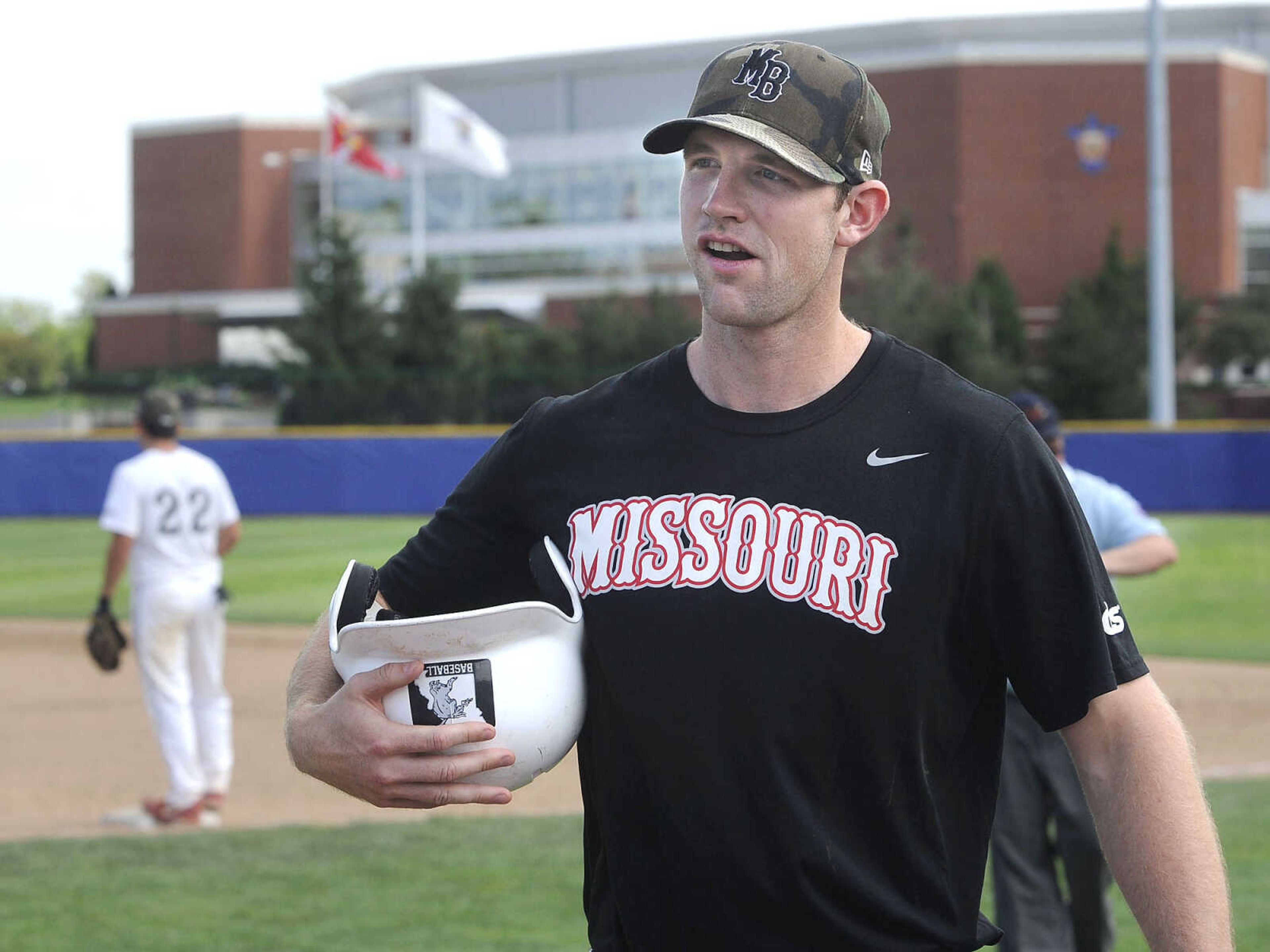 Lids Missouri Bulls 17u hitting coach Trenton Moses leaves the field after his team's at-bat Thursday, July 23, 2015 in St. Louis. (Fred Lynch)