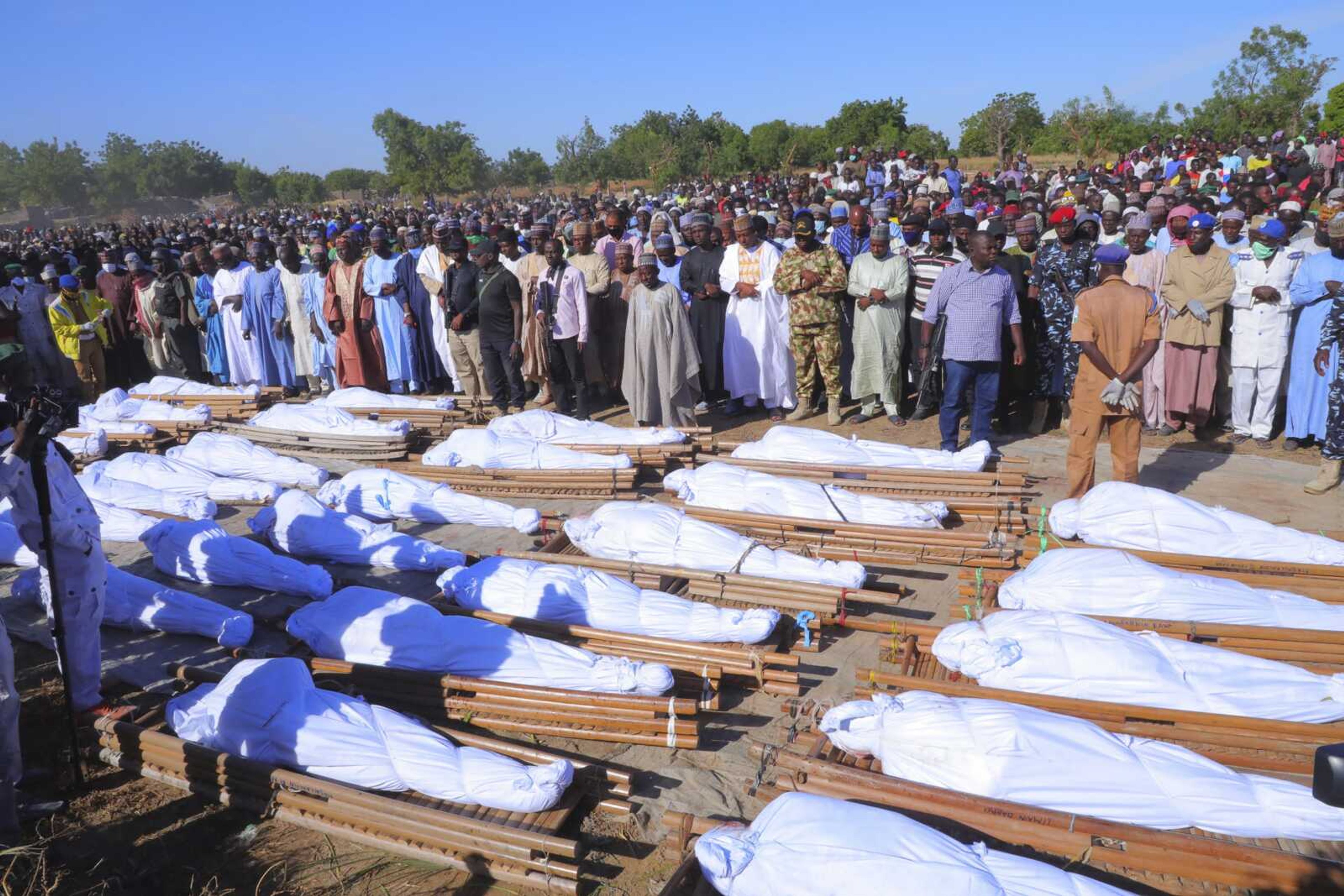 People attend a funeral for those killed Saturday by suspected Boko Haram militants, Sunday in Zaabarmar, Nigeria.