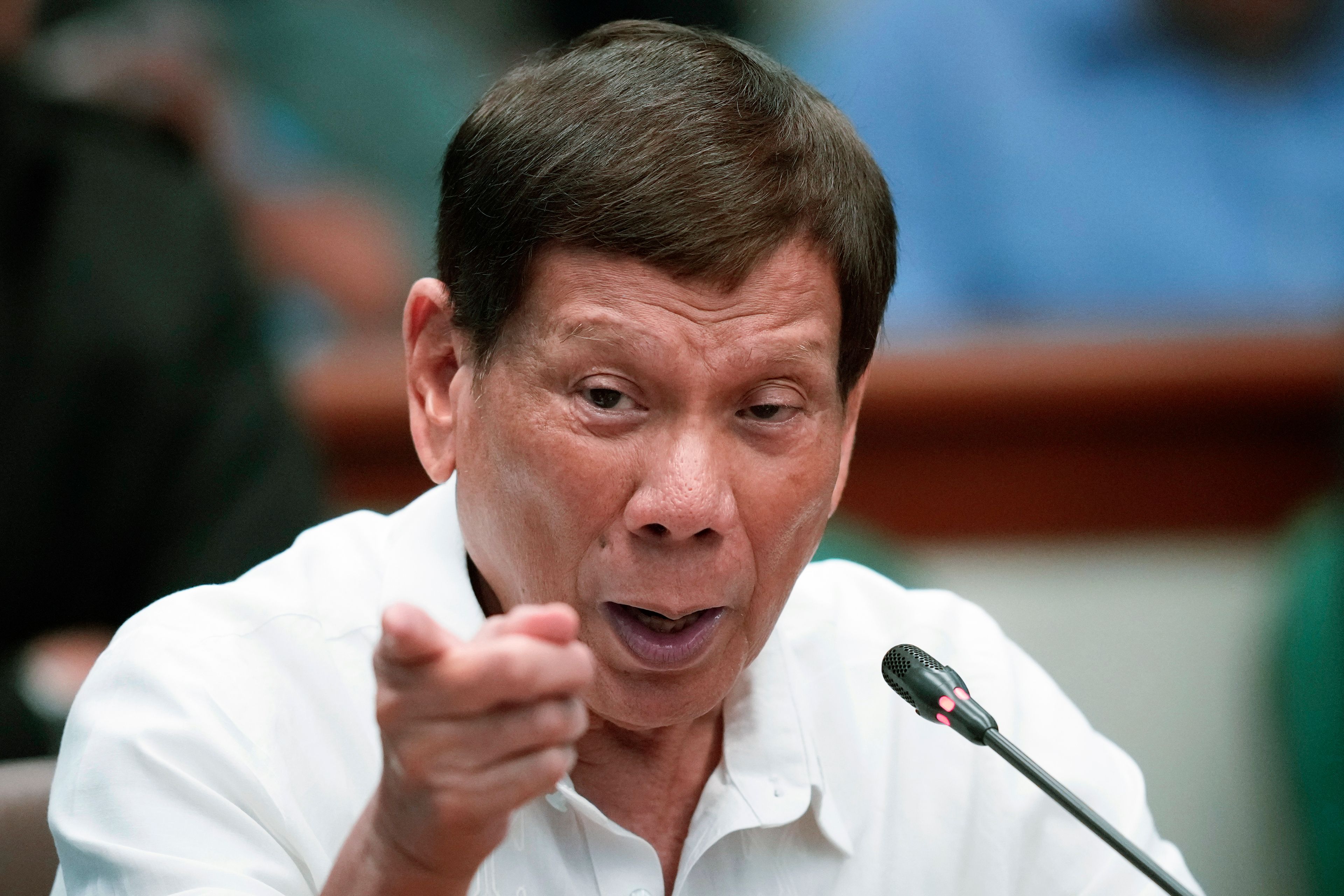 Former Philippine President Rodrigo Duterte gestures during a Senate investigation on the war on the drugs during his administration at the Philippine Senate Monday, Oct. 28, 2024, in Manila, Philippines. (AP Photo/Aaron Favila)