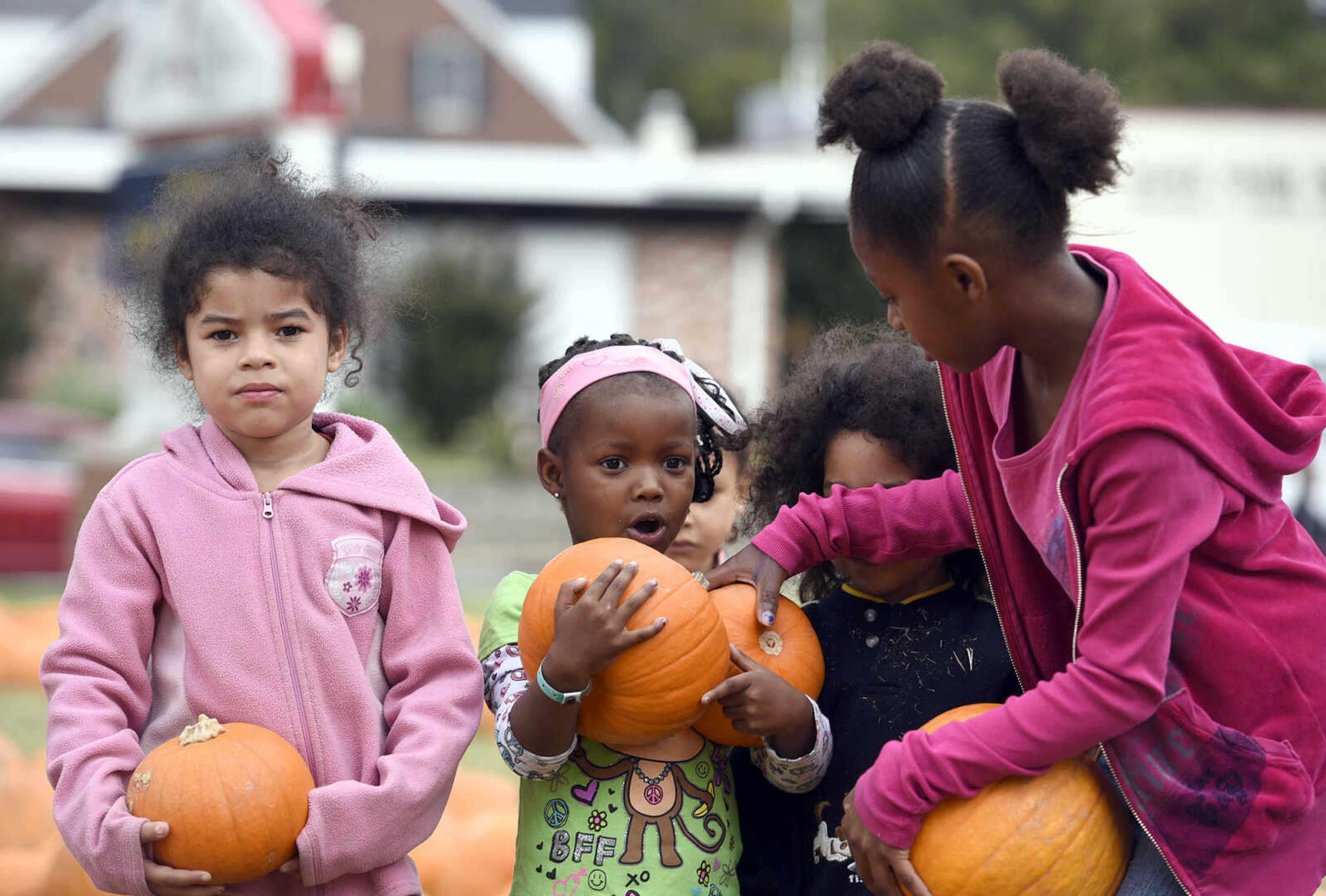 LAURA SIMON ~ lsimon@semissourian.com

From left to right, Maleah Espinoza, Dashlay Gilbert, Trenton Espinoza and Tia Gilbert pick out their pumpkins at the Grace United Methodist Church pumpkin patch on Wednesday, Oct. 12, 2016 in Cape Girardeau.