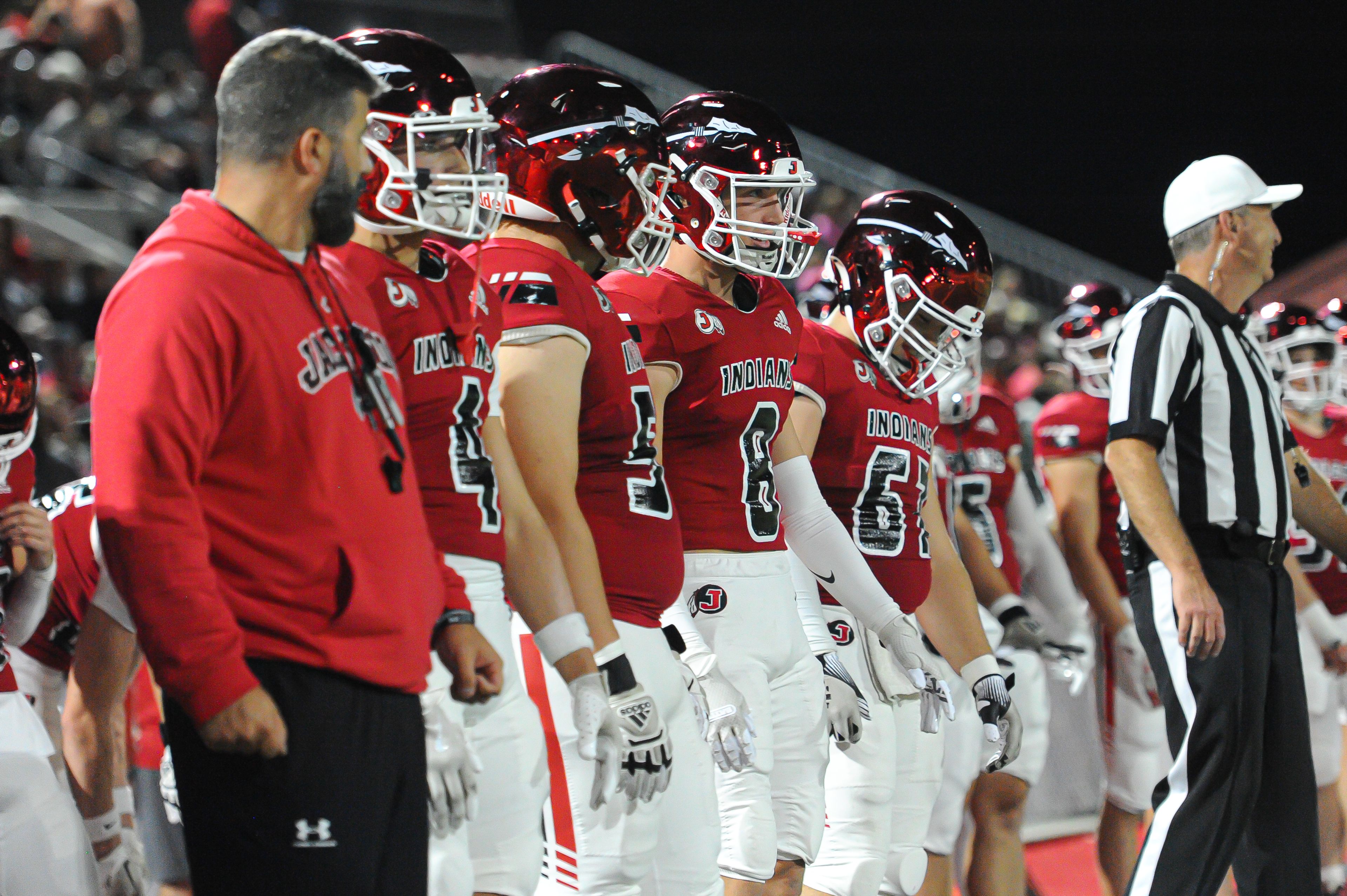 Jackson captains prepare for the coin toss before a Friday, October 25, 2024 game between the Jackson Indians and the Festus Tigers at "The Pit" in Jackson, Mo. Jackson defeated Festus, 43-7.