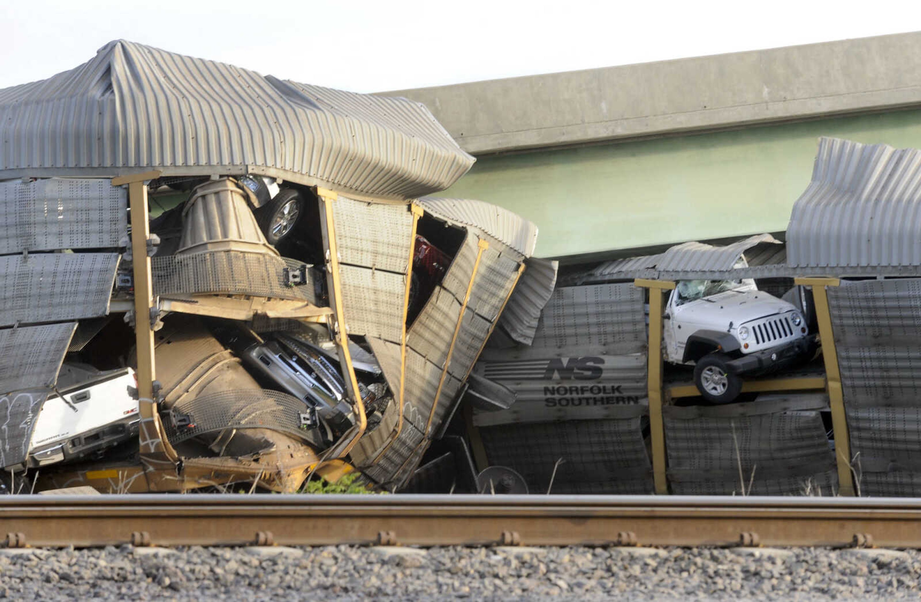 New vehicles were being transported on the Union Pacific train when it collided with a Burlington Northern Santa Fe train at Rockview, Mo. Saturday, May 25, 2013. (Fred Lynch)