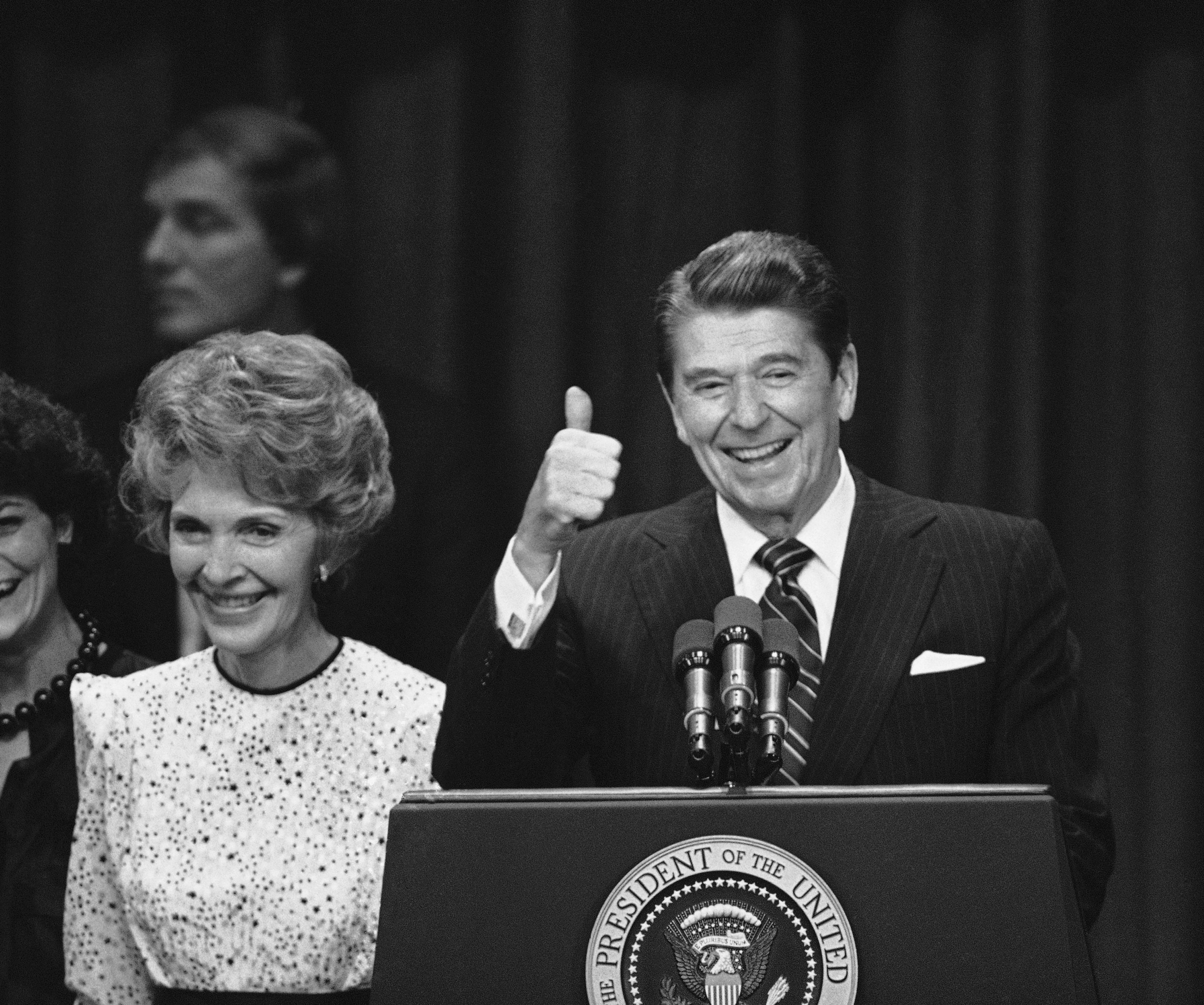 President Ronald Reagan signals his victory after his acceptance speech at the Century Plaza Hotel at night, Tuesday, Nov. 6, 1984 in Los Angeles where he said “You ain’t seen nothing’ yet” referring to the next four years in the Oval Office. 