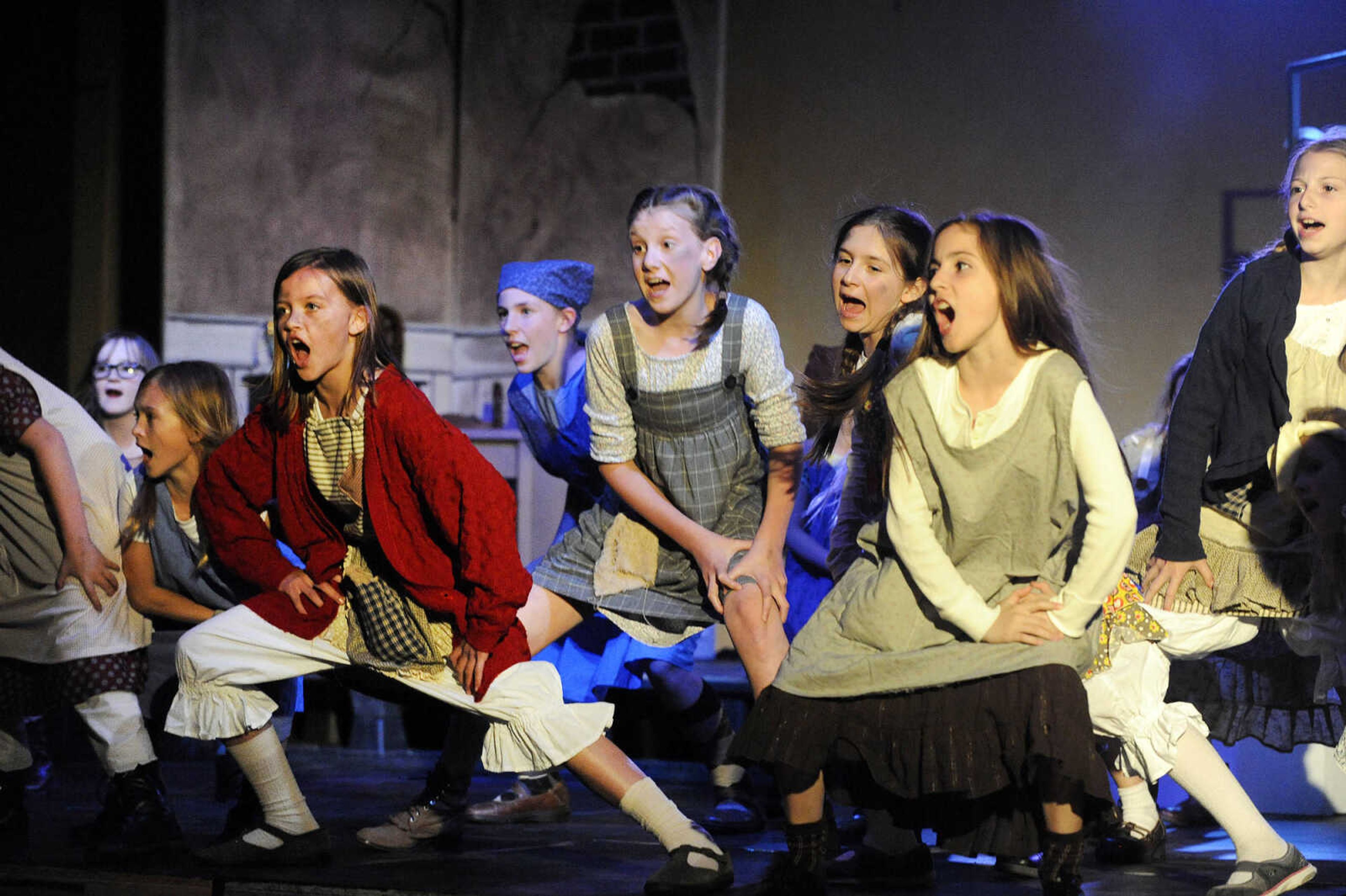 LAURA SIMON ~ lsimon@semissourian.com

Cast members rehearse for "Annie Jr." Wednesday night, May 4, 2016, at The Venue in Cape Girardeau. The condensed version of "Annie" is being produced by On Cue Performing Arts Studio, and the not-for-profit local theater group Acting Out!.