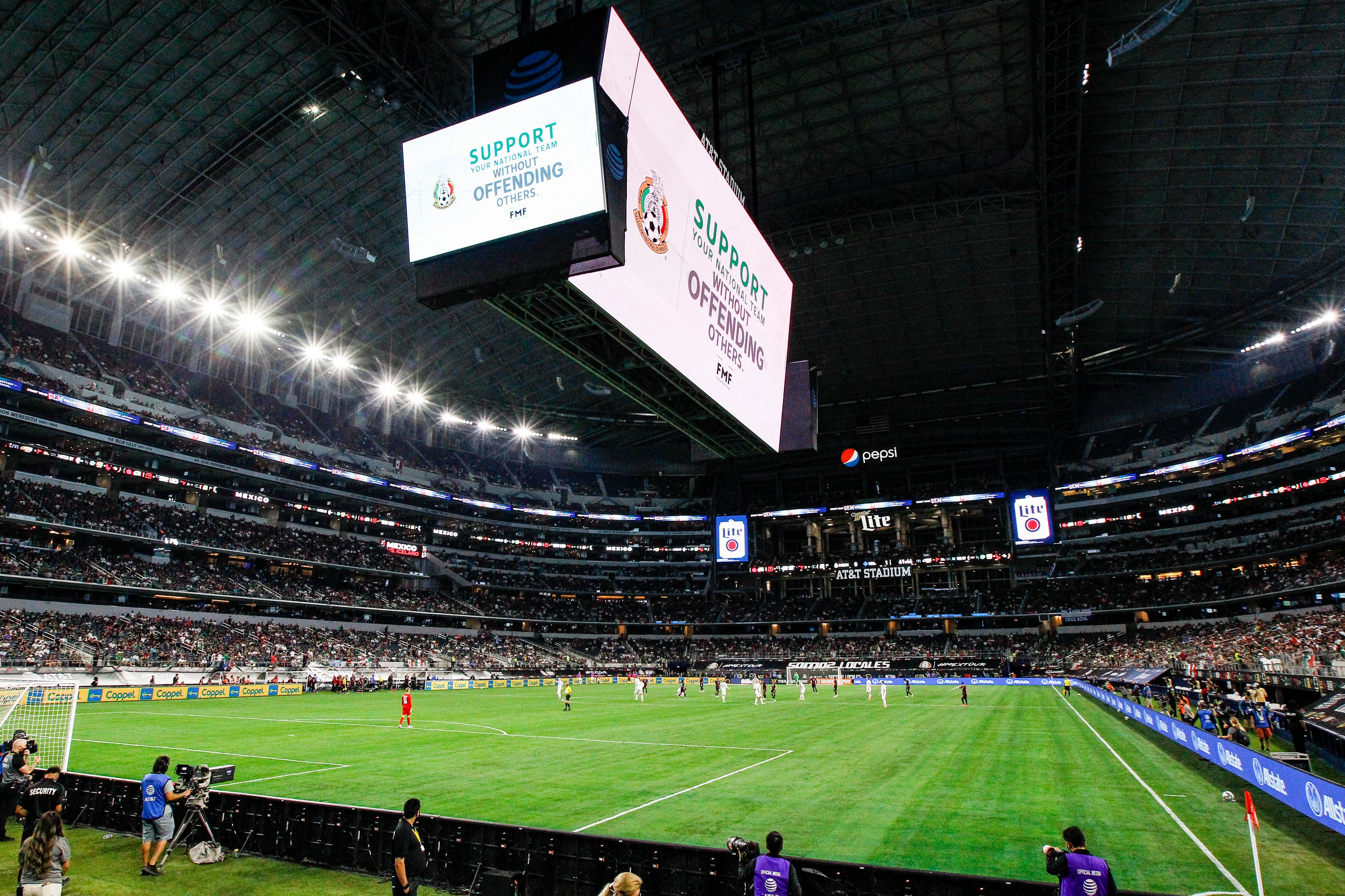 FILE - A message on the video board warns fans to not chant a homophobic slur during an international friendly soccer match between Mexico and Iceland, May 29, 2021, in Arlington, Texas. Mexico won 2-1. (AP Photo/Brandon Wade, File)