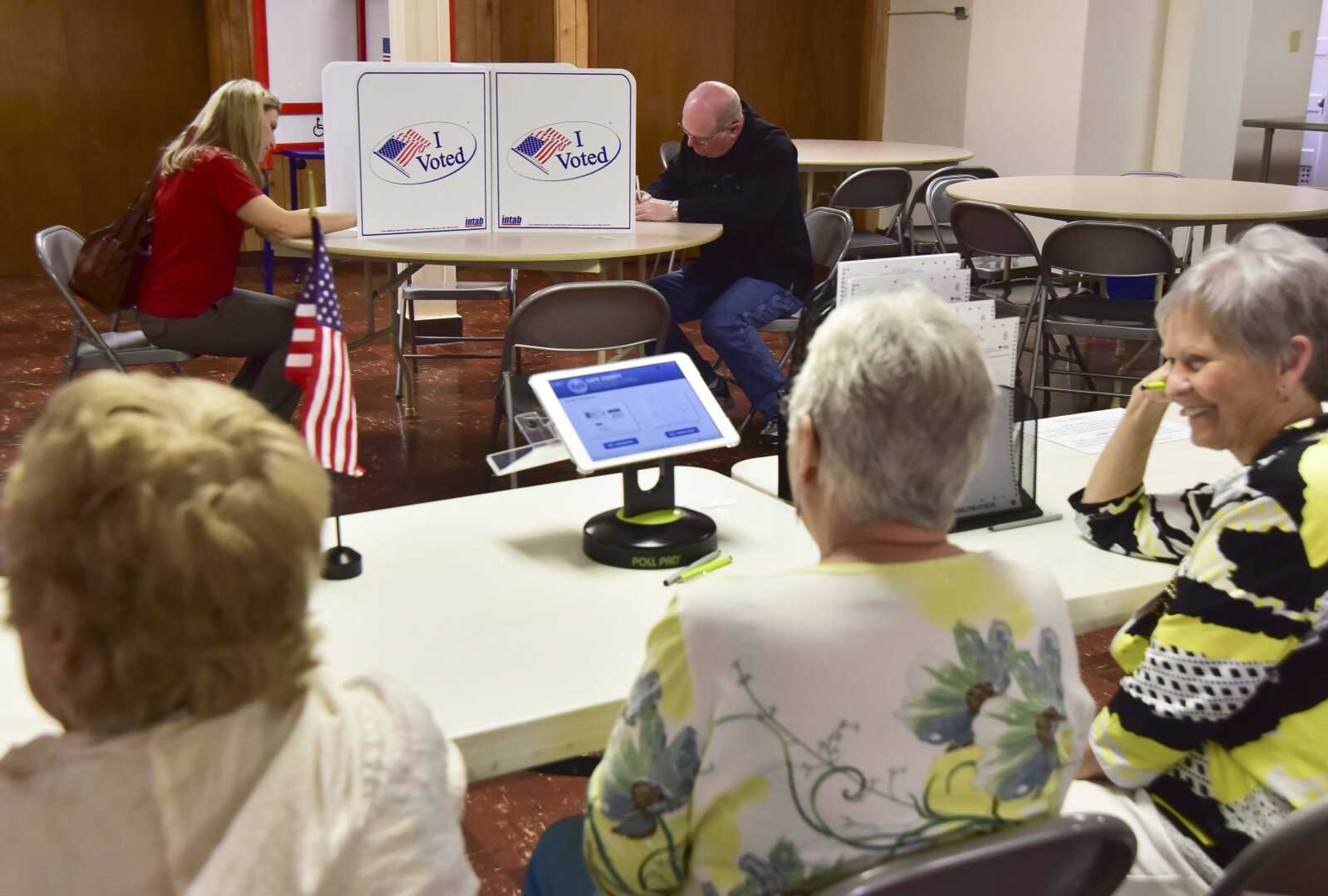 Kim Adams and David Seyer vote Tuesday at the New McKendree United Methodist Church in Jackson.