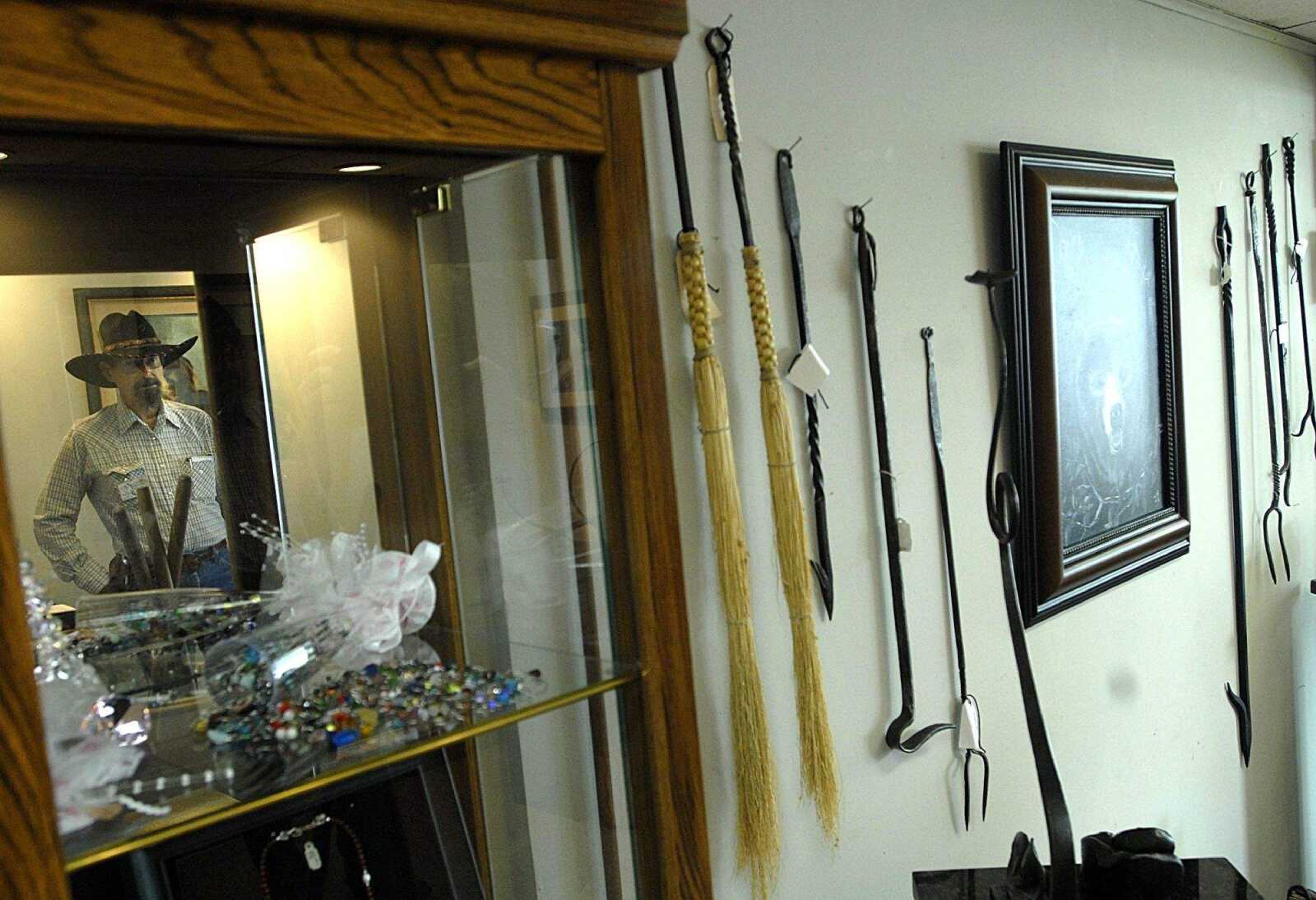 AARON EISENHAUER ~ aeisenhauer@semissourian.com
Blacksmith artist Jon Abernathy stands near his work at the Westray/Cat Ranch Art Guild.