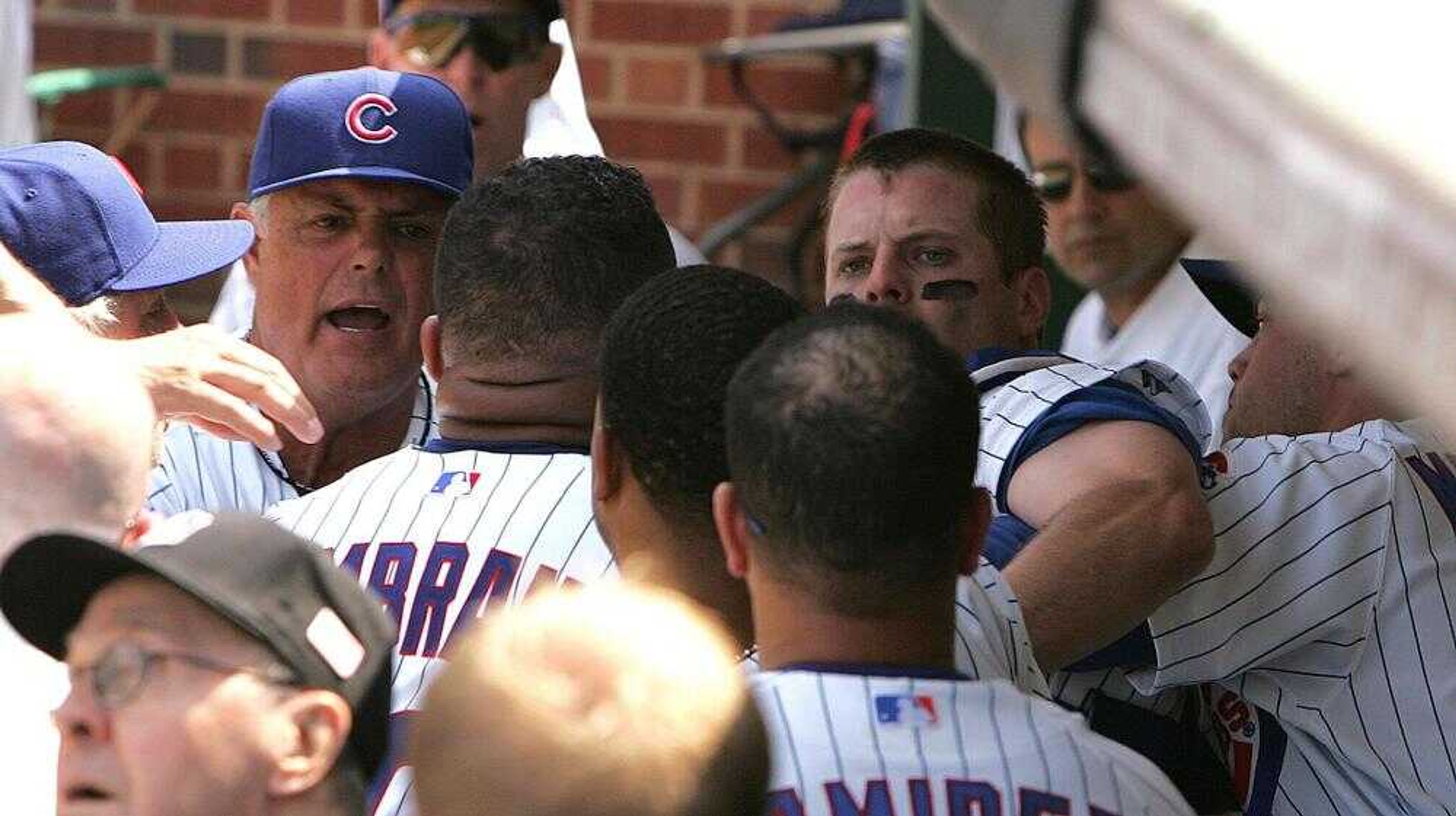 Chicago Cubs catcher Michael Barrett, right, and pitcher Carlos Zambrano scuffled in the dugout in the bottom of the fifth inning during Friday's game against the Atlanta Braves in Chicago. (PHIL VELASQUEZ ~ Chicago Tribune)