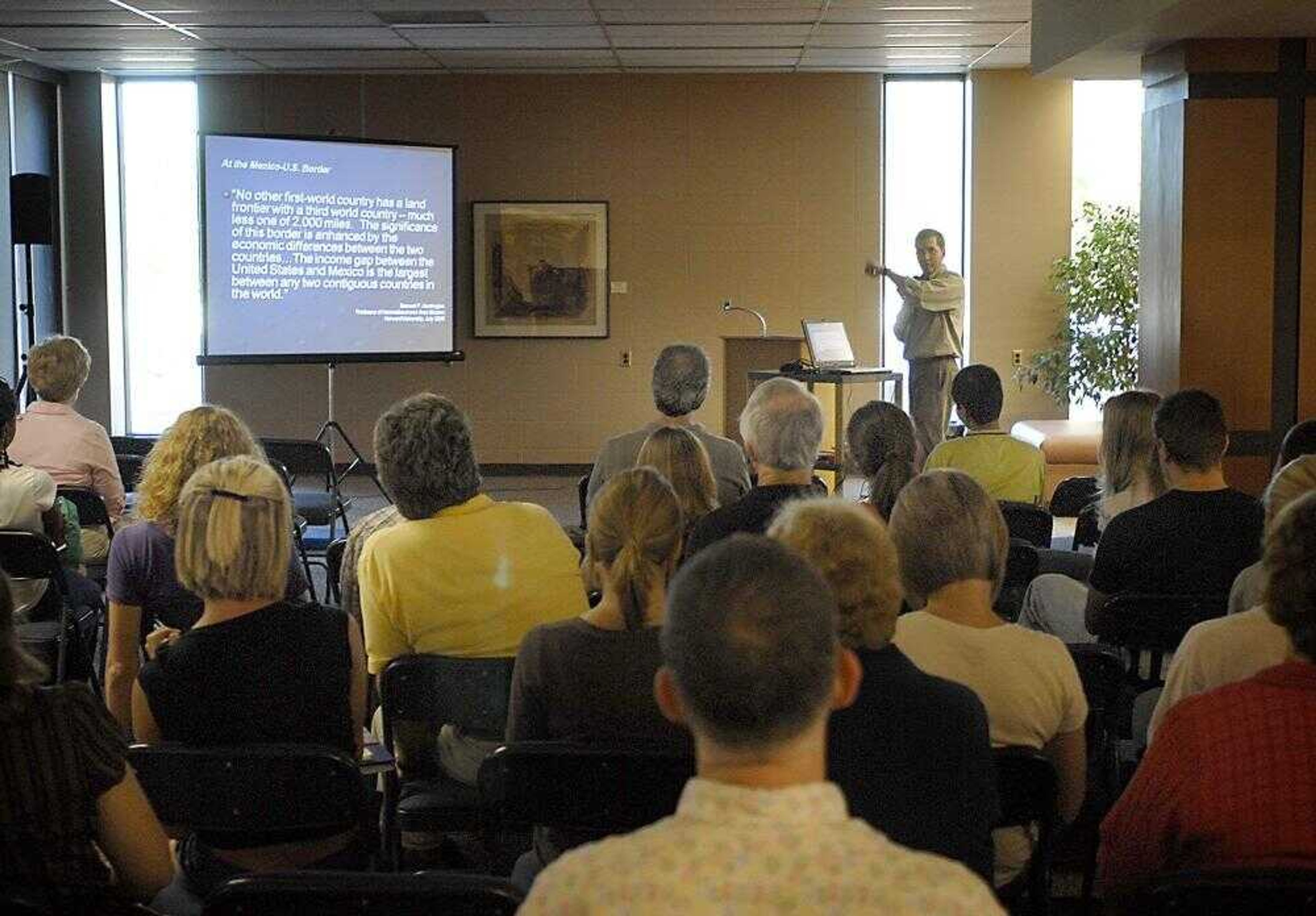 Dr. Warren Anderson, rear right, spoke about immigration to roughly 50 people Tuesday in Kent Library on the Southeast Missouri State University campus. (Kit Doyle)