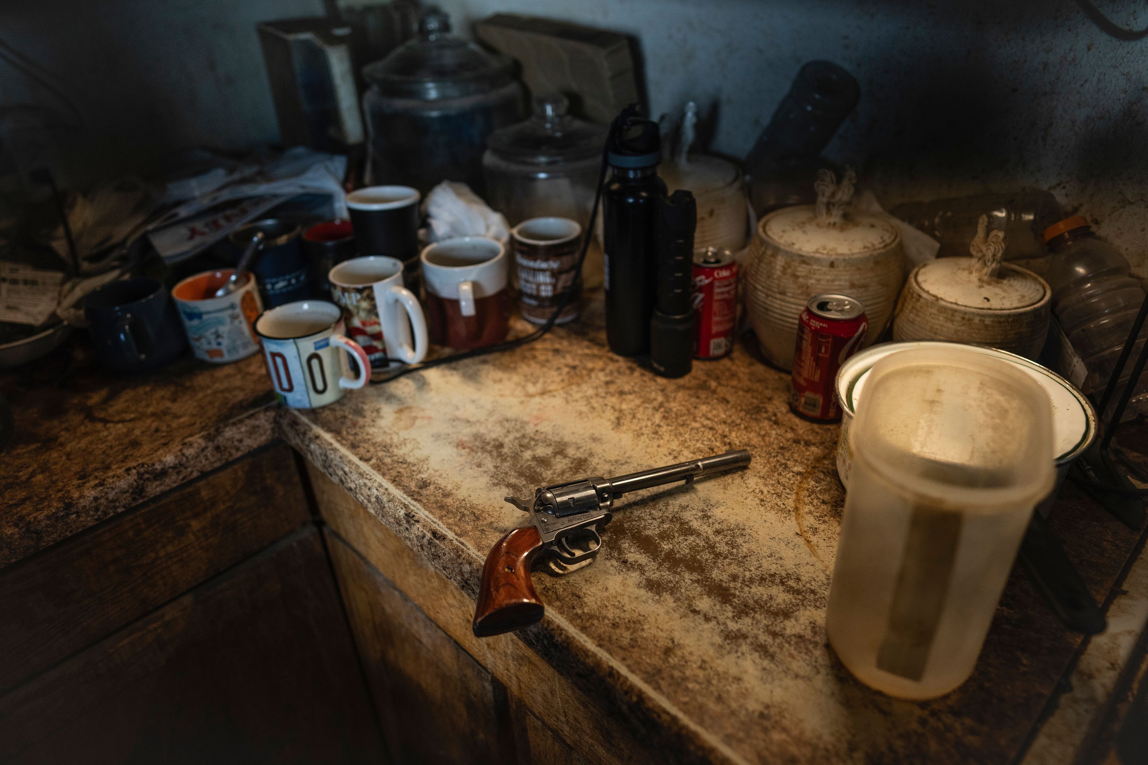 Richard Begay's gun lies on his kitchen counter, on the Navajo Nation in Dilkon, Ariz., Wednesday, Oct. 16, 2024. (AP Photo/Rodrigo Abd)