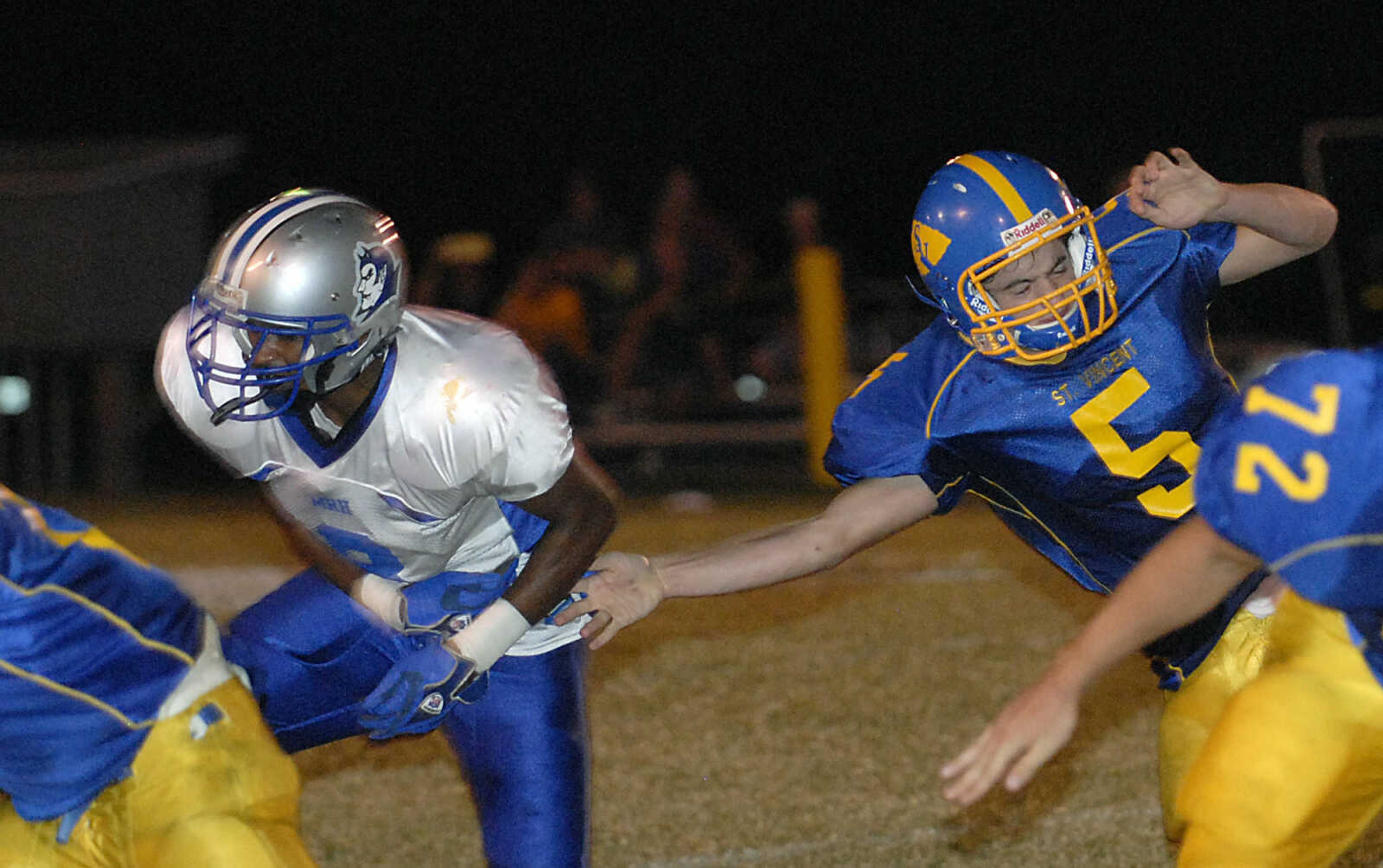 KIT DOYLE ~ kdoyle@semissourian.com
The St. Vincent quarterback Tim Schumer (5) fumbles the ball while falling after being hit from the blind side Friday evening, September 18, 2009, in Perryville.