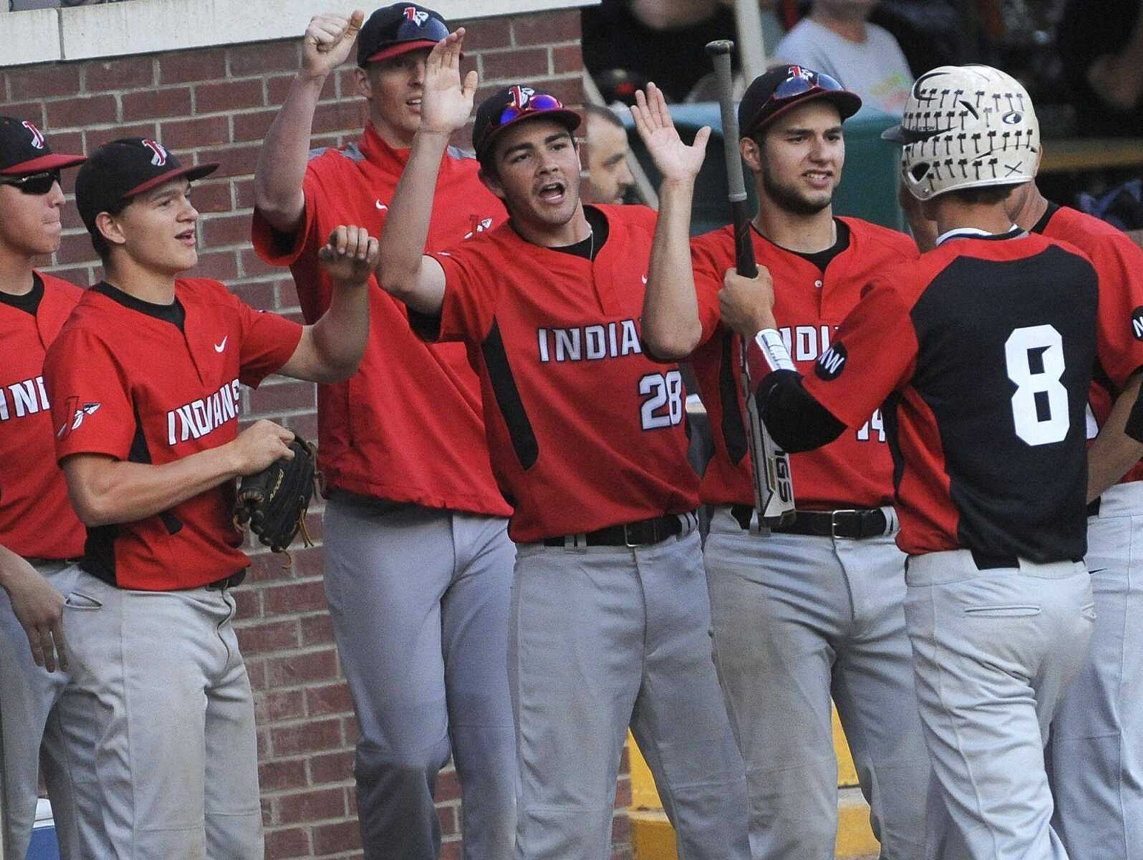 Jackson players celebrate as Landon Mills returns to the dugout after scoring against Farmington on a double by Wyatt Eldridge during the fourth inning of a Class 5 District 1 semifinal Tuesday, May 19, 2015 in Farmington, Missouri. (Fred Lynch)