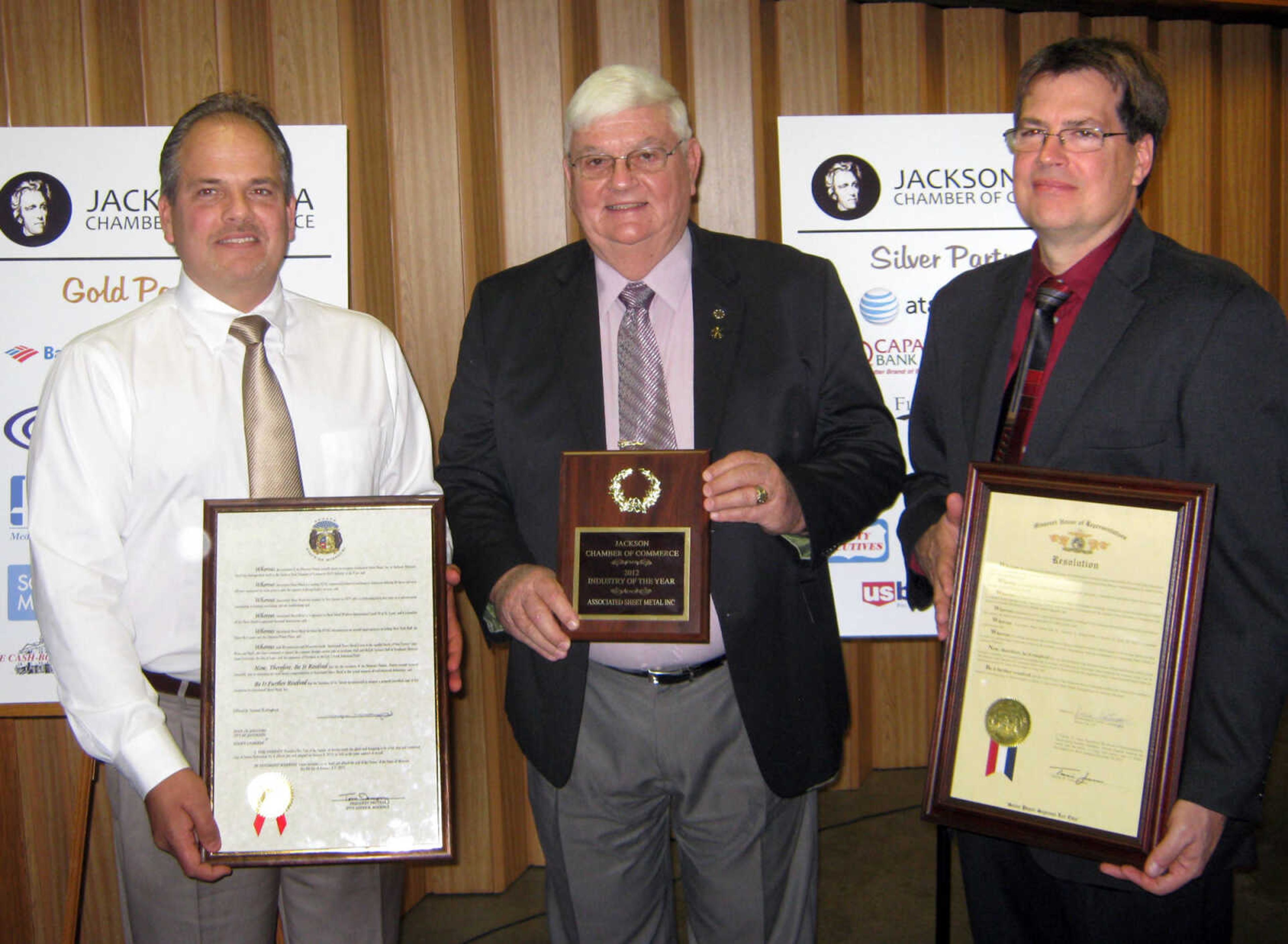 Boyd Sievers, left, Tom Sievers and Brian Sievers receive the Industry of the Year award for Associated Sheet Metal, Jan. 11, at the Jackson Area Chamber of Commerce annual awards banquet at the Knights of Columbus Hall in Jackson, Mo.