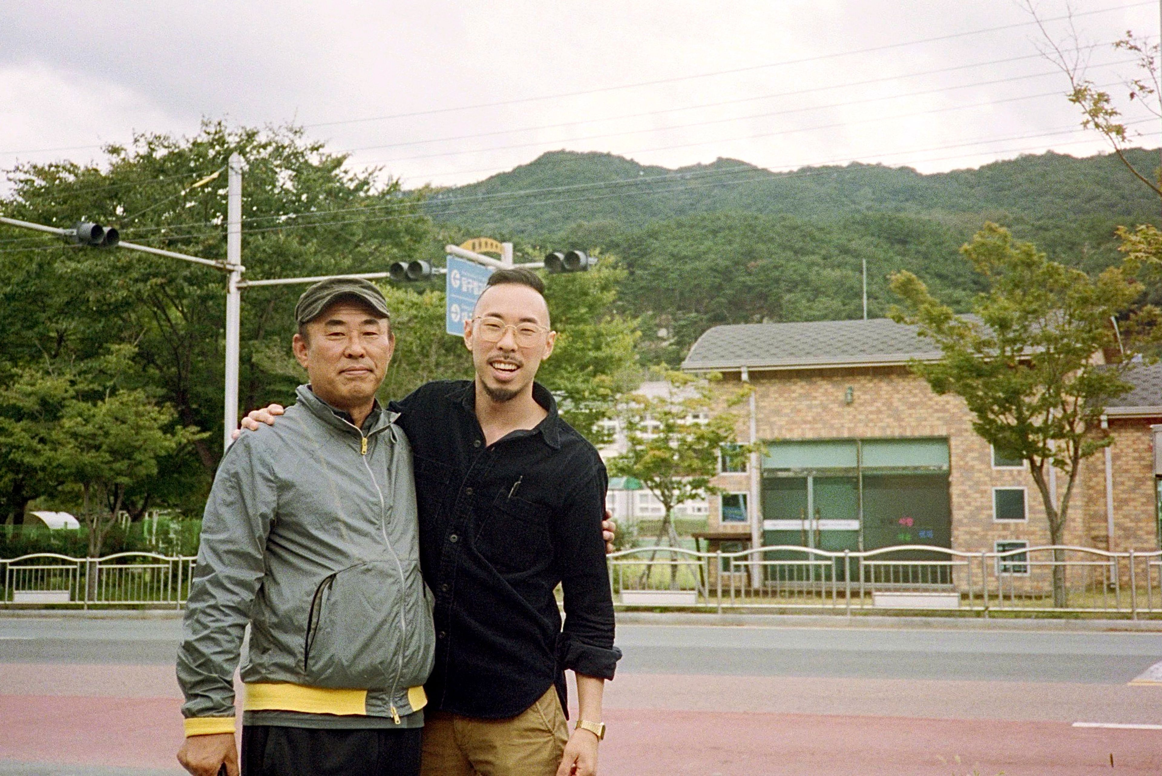 In this photo provided by Robert Calabretta, right, he and and his biological father, Lee Sung-soo, stand together for a photo while on a visit in Daegu, South Korea, in August of 2020, during the COVID-19 pandemic. (Courtesy Robert Calabretta via AP)