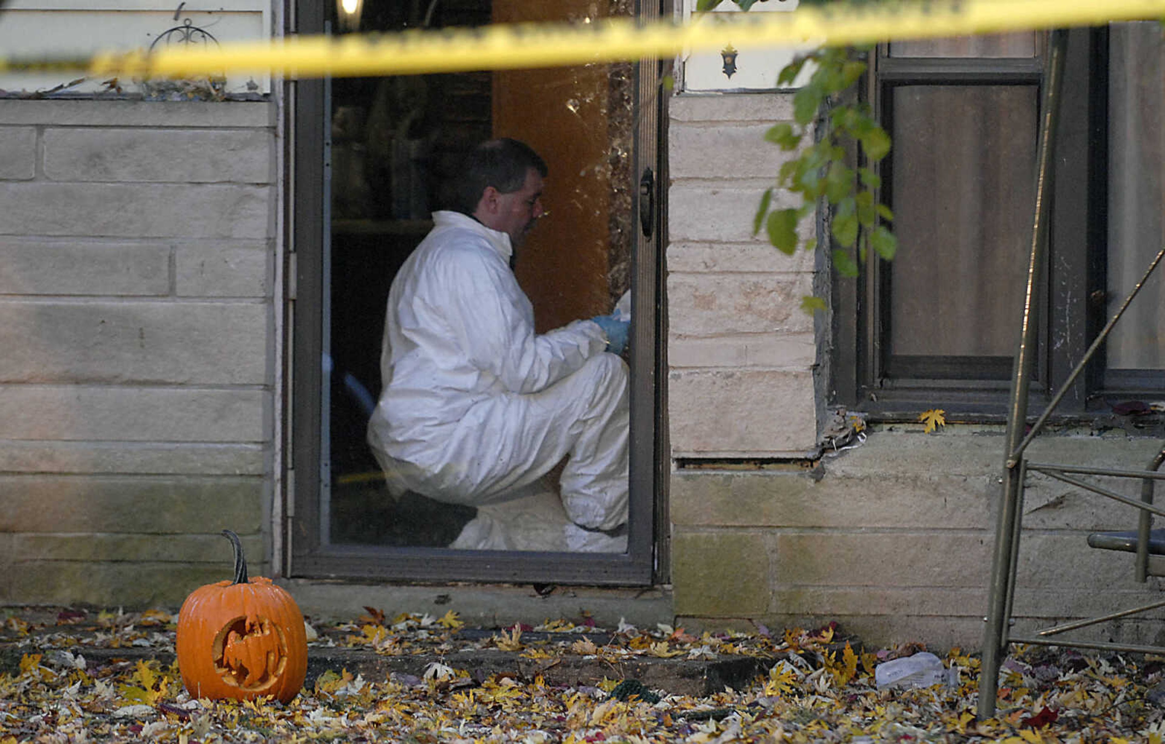 KIT DOYLE ~ kdoyle@semissourian.com
Authorities work inside 1224 N. Missouri St. Tuesday morning, October 27, 2009, in Cape Girardeau.