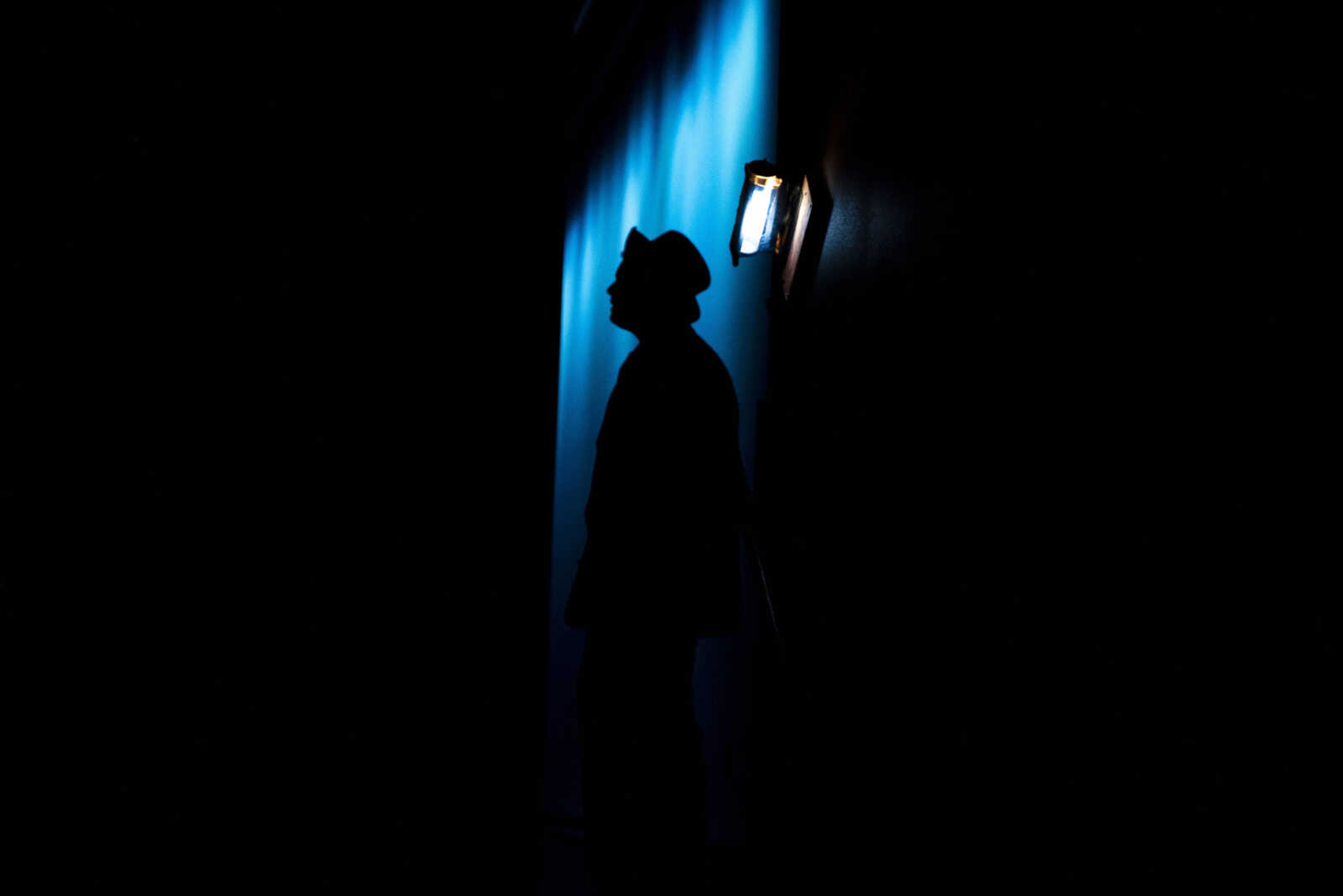 A cast member is silhouetted before going on during opening night of the spring musical production of "Hello Dolly" at Notre Dame Regional High School Thursday, April 4, 2019, in Cape Girardeau.