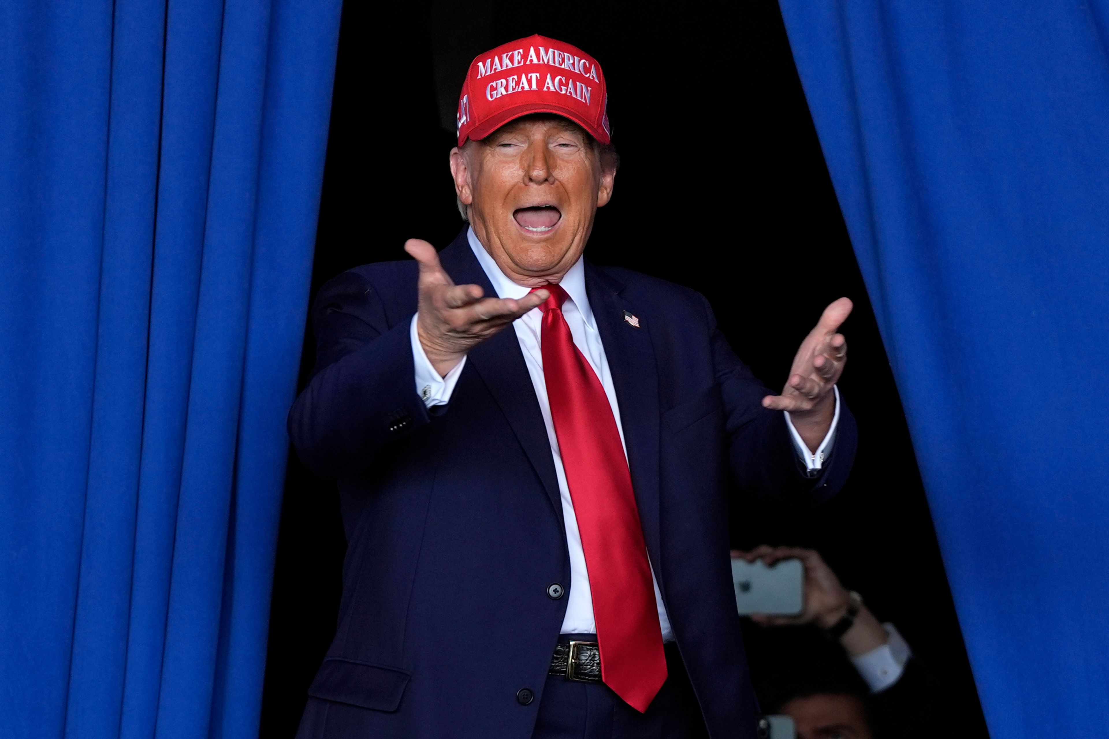 Republican presidential nominee former President Donald Trump arrives to speak during a campaign rally at Dodge County Airport, Sunday, Oct. 6, 2024, in Juneau, Wis. (AP Photo/Julia Demaree Nikhinson)