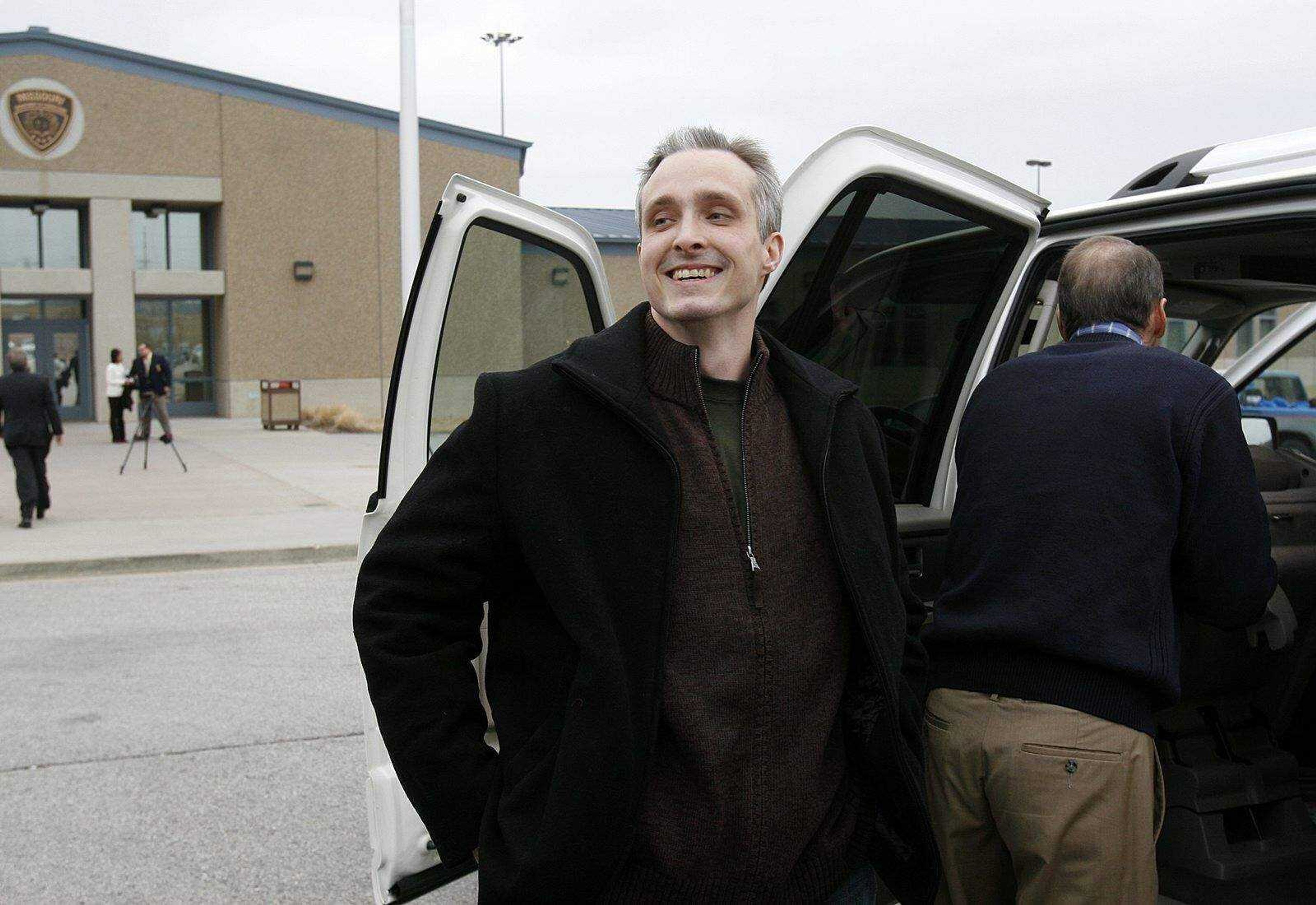 ELIZABETH DODD ~ edodd@semissourian.com
Joshua C Kezer laughs after bowing to the media before getting in the car that was leading him away from Jefferson City Correctional Center a free man Wednesday.