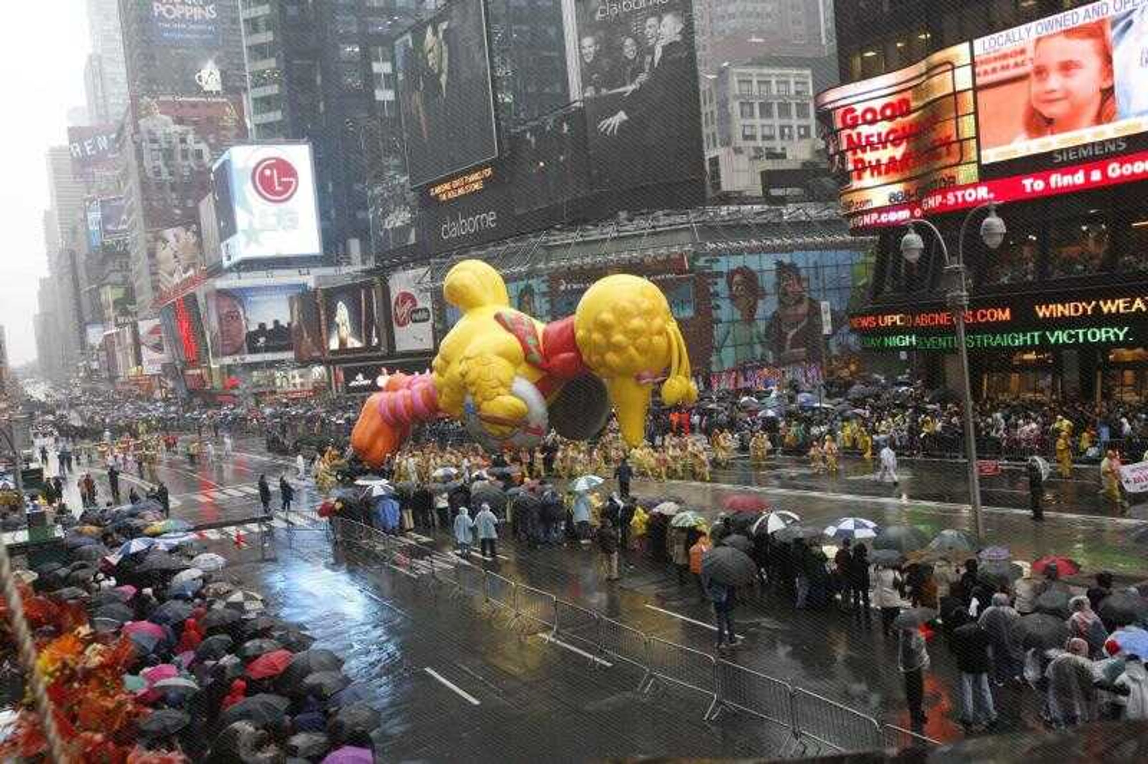 The Big Bird balloon flew low to the ground due to weather conditions during the 80th annual Macy's Thanksgiving Day Parade Thursday as seen from the Hard Rock Cafe marquee overlooking New York City's Times Square. (Diane Bondareff ~ Hard Rock Cafe)