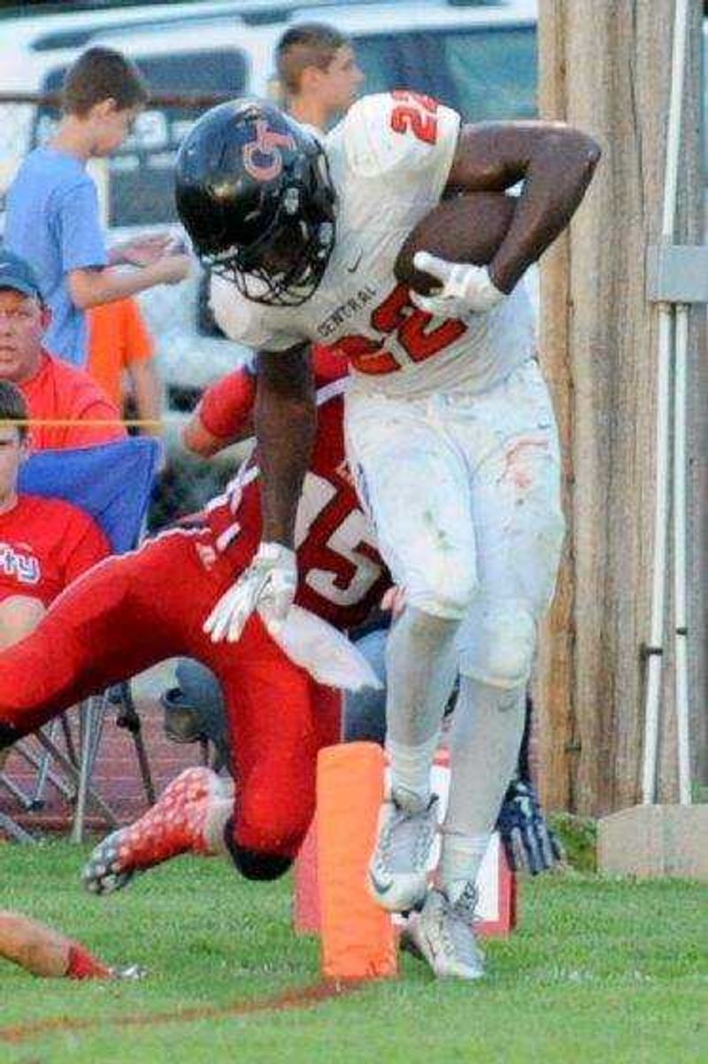 Cape Central's Aaron Harris scores a touchdown past Liberty's Koel Orchard on Friday, Aug. 19, 2016 in Mountain View, Missouri.