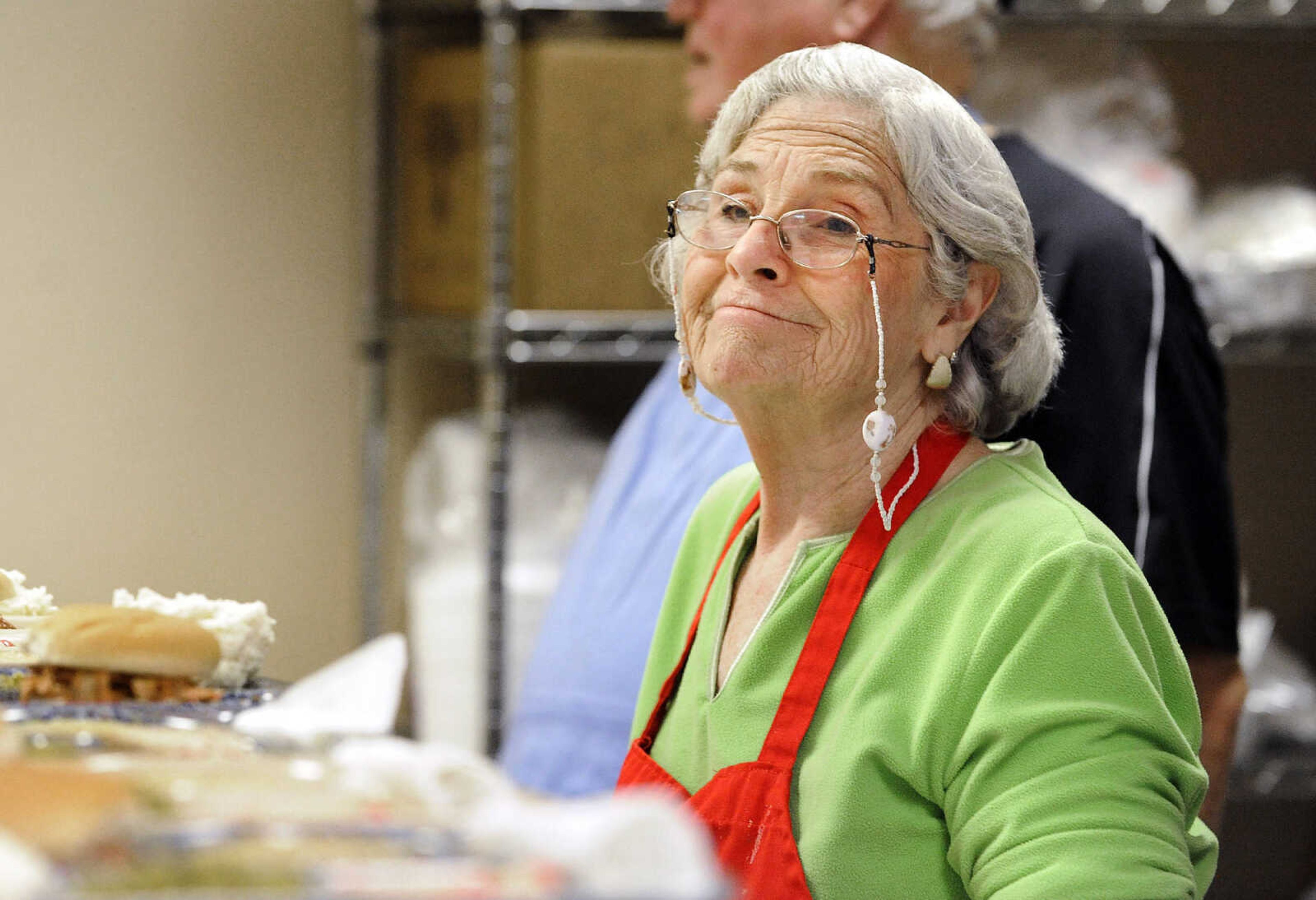 LAURA SIMON ~ lsimon@semissourian.com

Elaine Shirrell looks up while serving lunch Monday afternoon, Feb. 22, 2016, during meals with friends at the Salvation Army in Cape Girardeau. The last two full weeks of the month, the Salvation Army hosts meals with friends, an event where people can come have a hot meal, and also take a meal home.