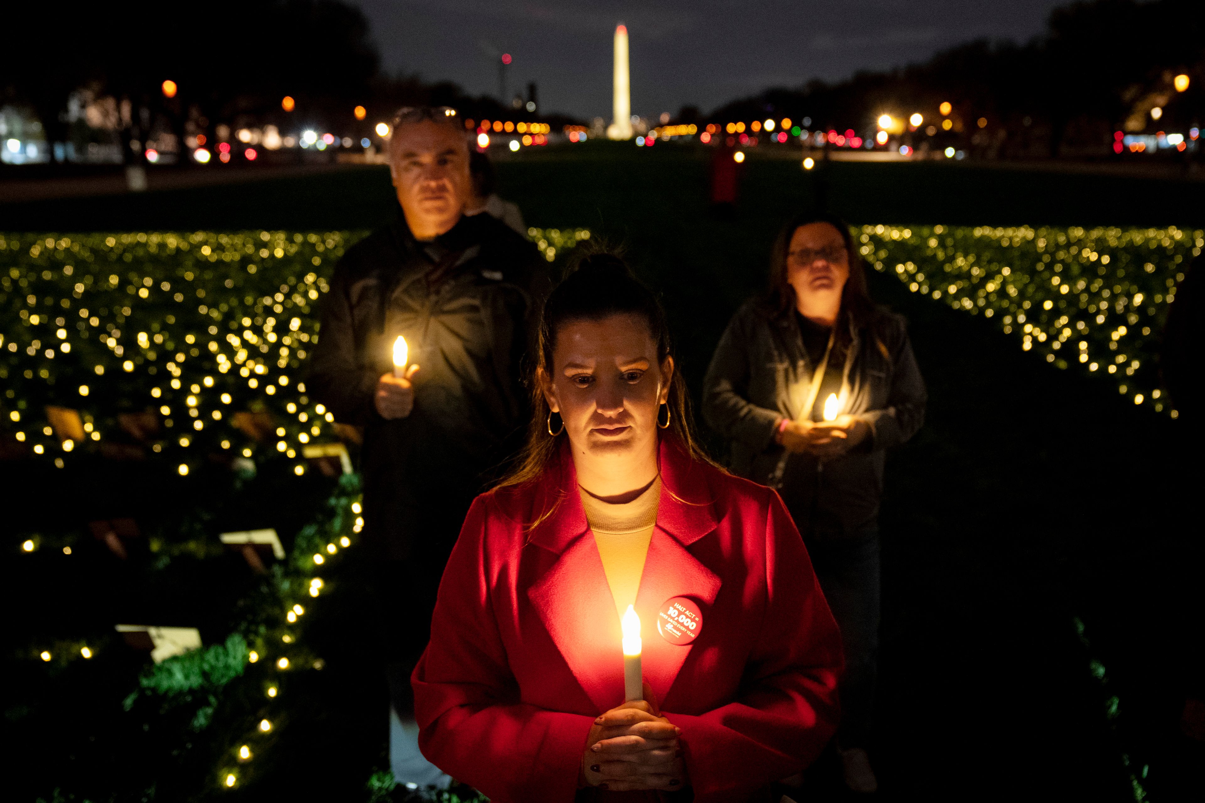 Rachel Lamar of Ft. Lauderdale, Fla., a member of Mothers Against Drunk Driving (MADD), attends a candlelight vigil for people killed by drunk drivers, Tuesday, Nov. 19, 2024, on the National Mall, in Washington. (AP Photo/Jacquelyn Martin)