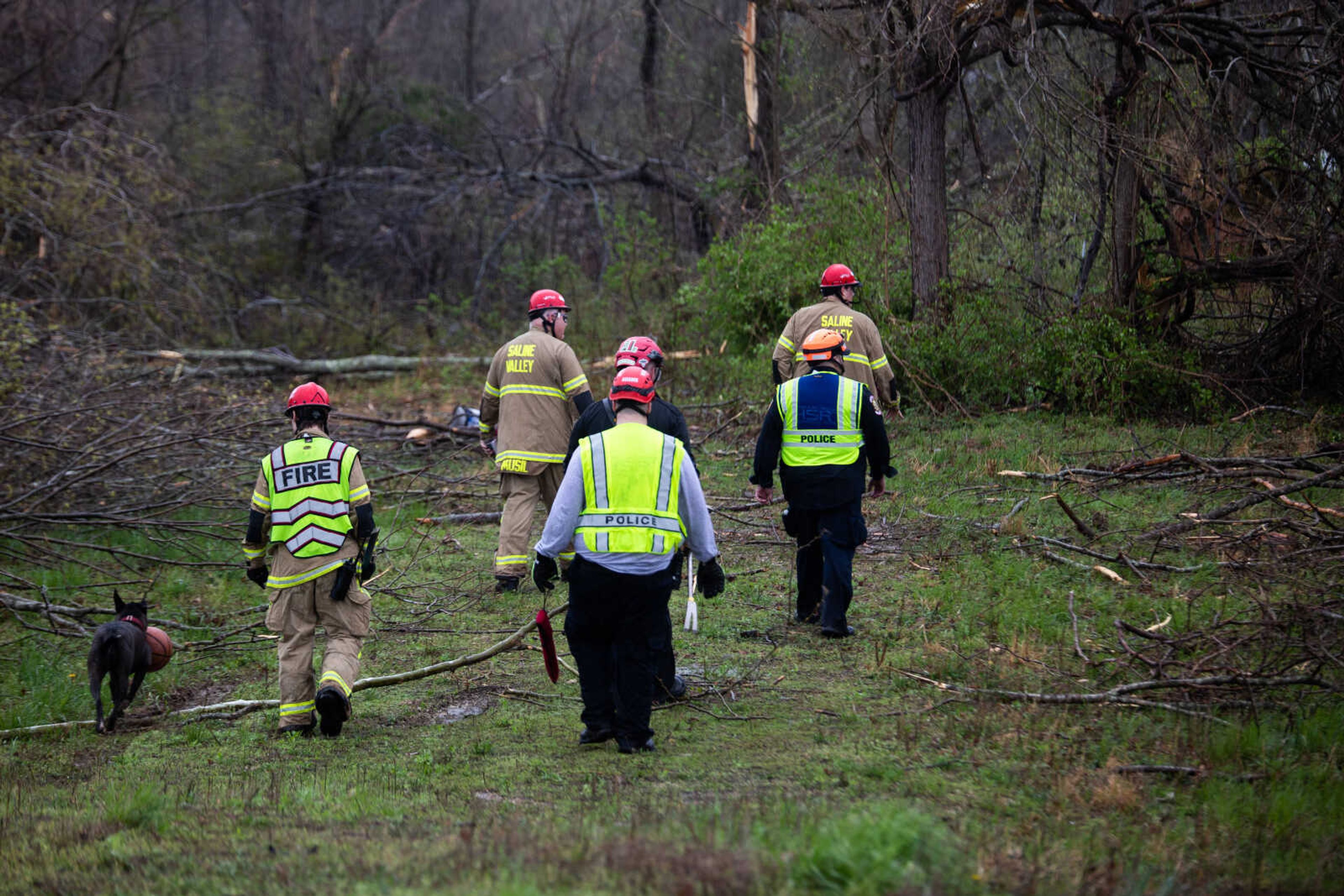 Firefighters assess the damage in Glen Allen.