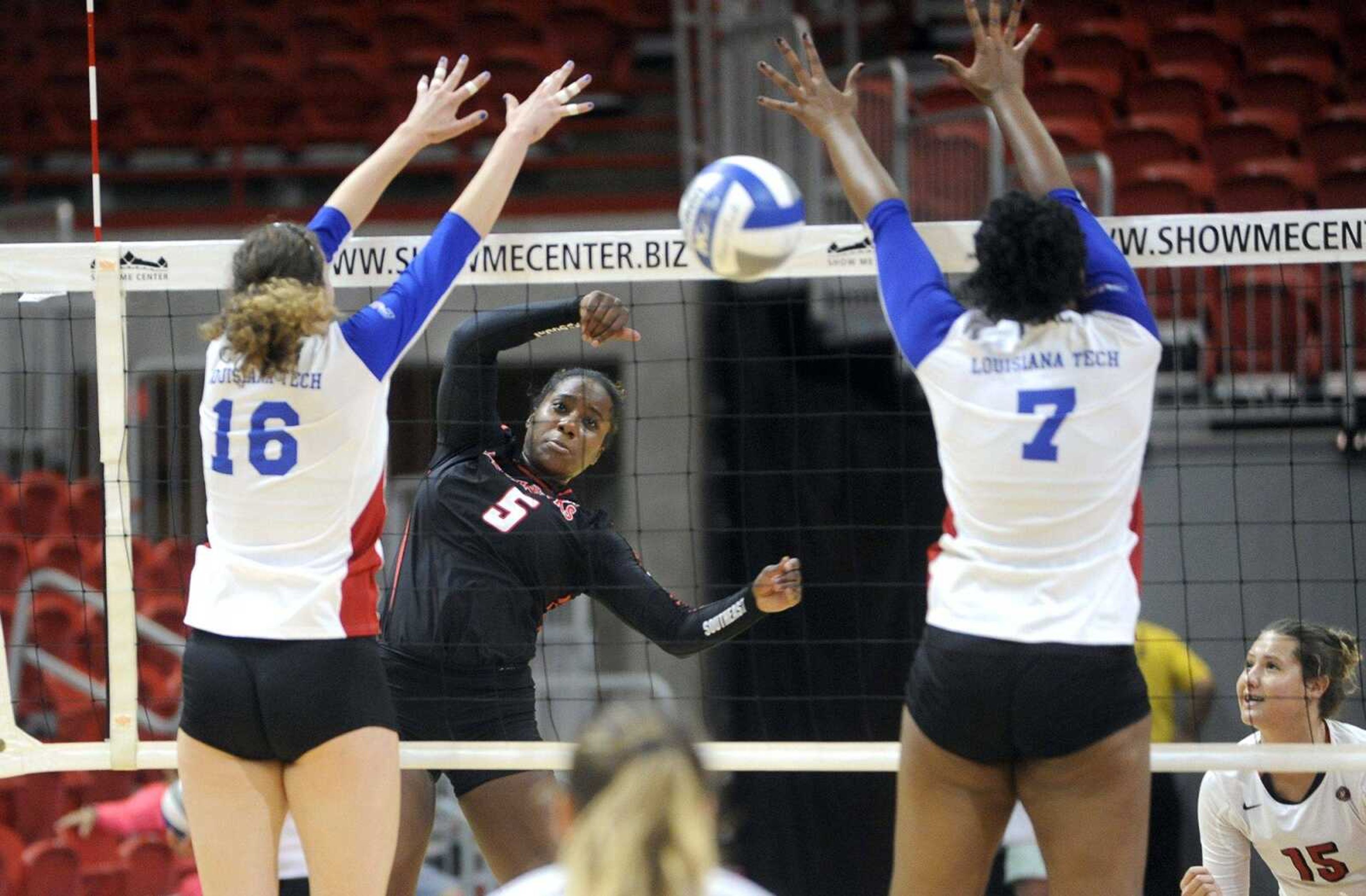 Southeast Missouri State outside hitter Krissa Gearring spikes the ball past Louisiana Tech's Angela Papach, left, and Alexa Lister during the first set Saturday at the Show Me Center. Tech rallied for a five-set victory.