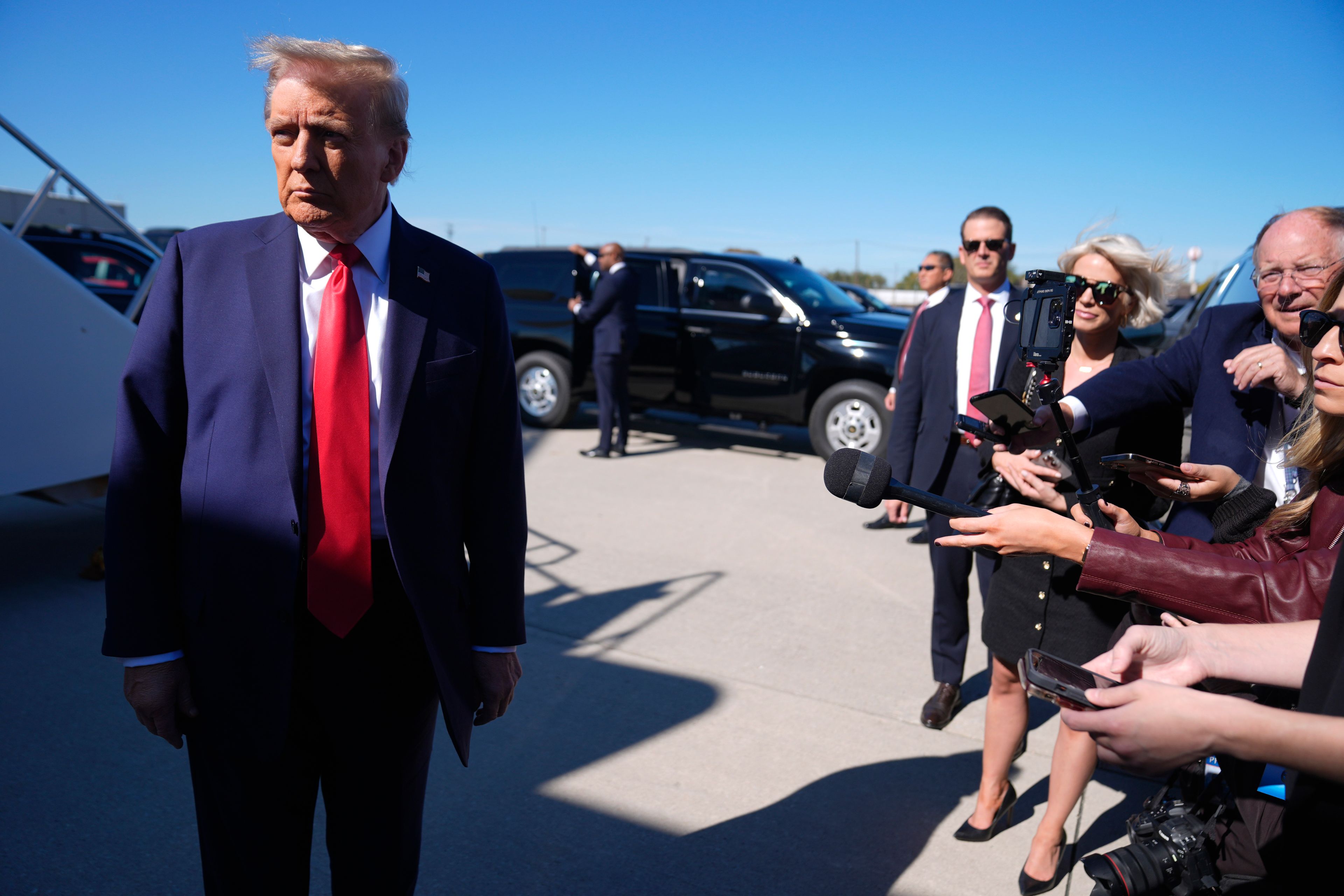 Republican presidential nominee former President Donald Trump speaks with reporters upon arrival at Philadelphia International Airport, Sunday, Oct. 20, 2024, in Philadelphia. (AP Photo/Evan Vucci)