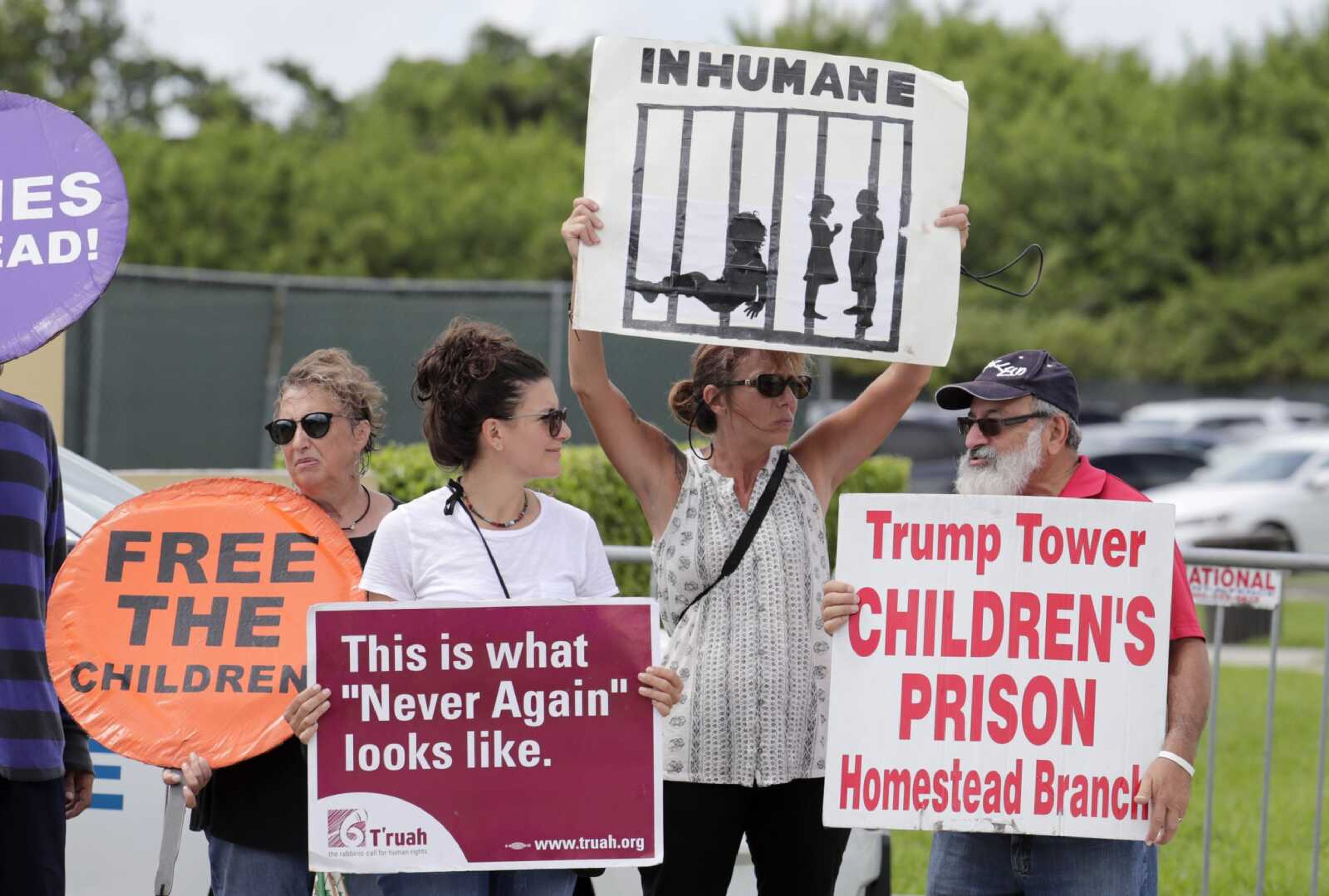 Protesters hold signs outside of the Homestead Temporary Shelter for Unaccompanied Children in July while members of Congress tour the facility in Homestead, Florida. The government will be able to hold immigrant children detained at the Mexican border for a longer period under a move by the Trump administration.