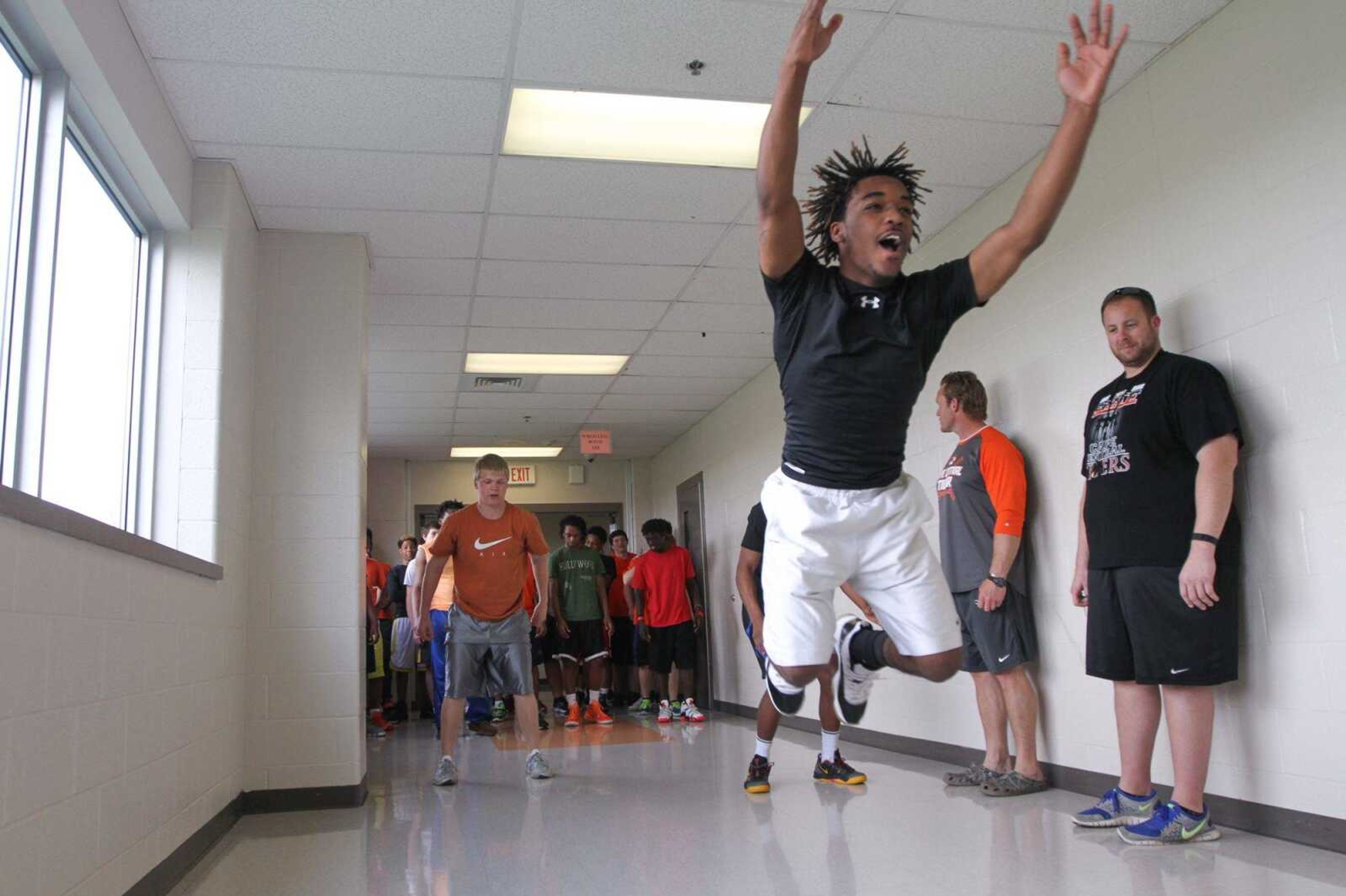 Cape Central's Felawn Smith leaps down the hallway at Cape Central High School during a team workout Wednesday, April 8, 2015. (Glenn Landberg)