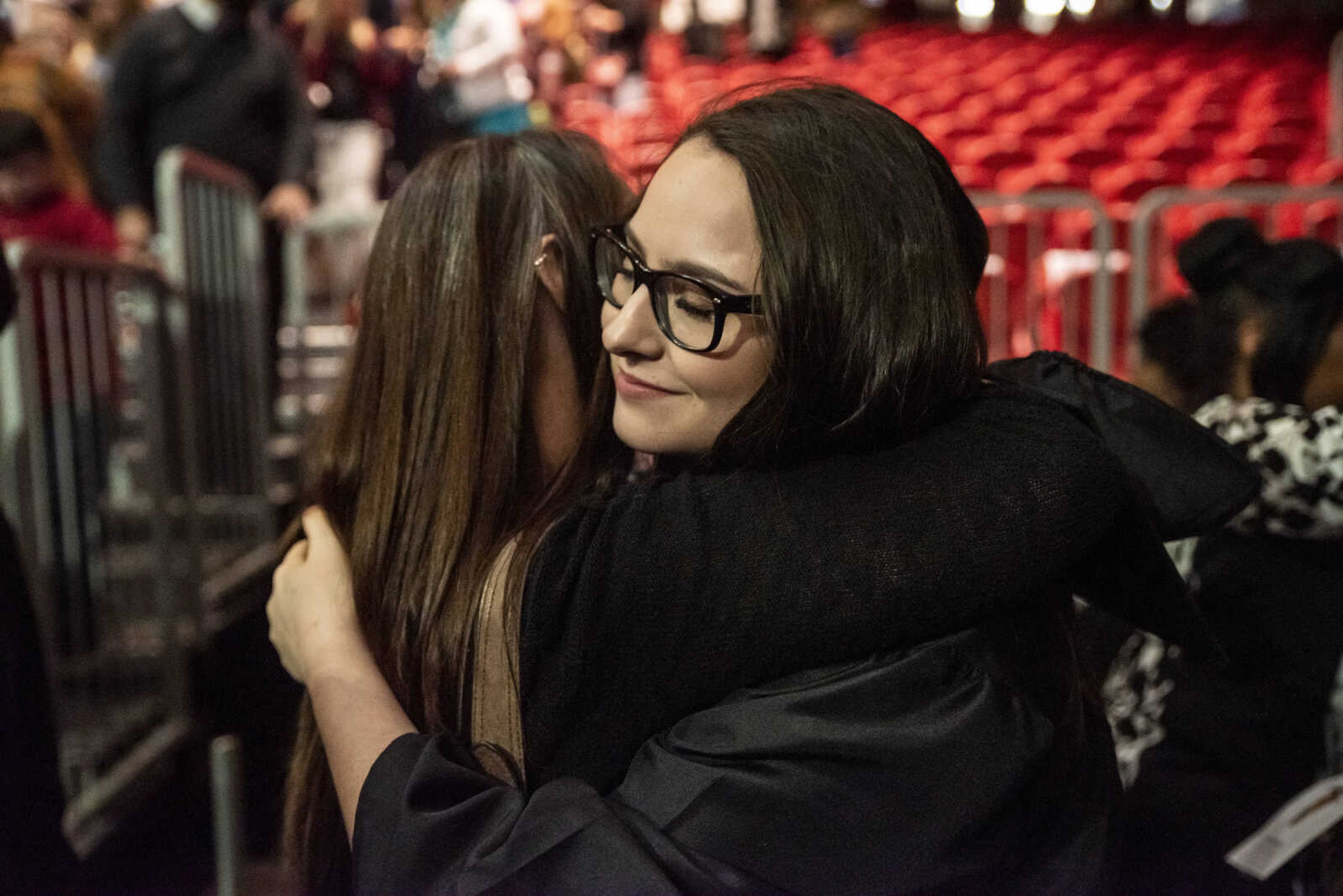 Emily Medlock receives a hug from her mom, Missy Medlock, at the conclusion of the Cape Central High School Class of 2019 Commencement at the Show Me Center Sunday, May 12, 2019, in Cape Girardeau.