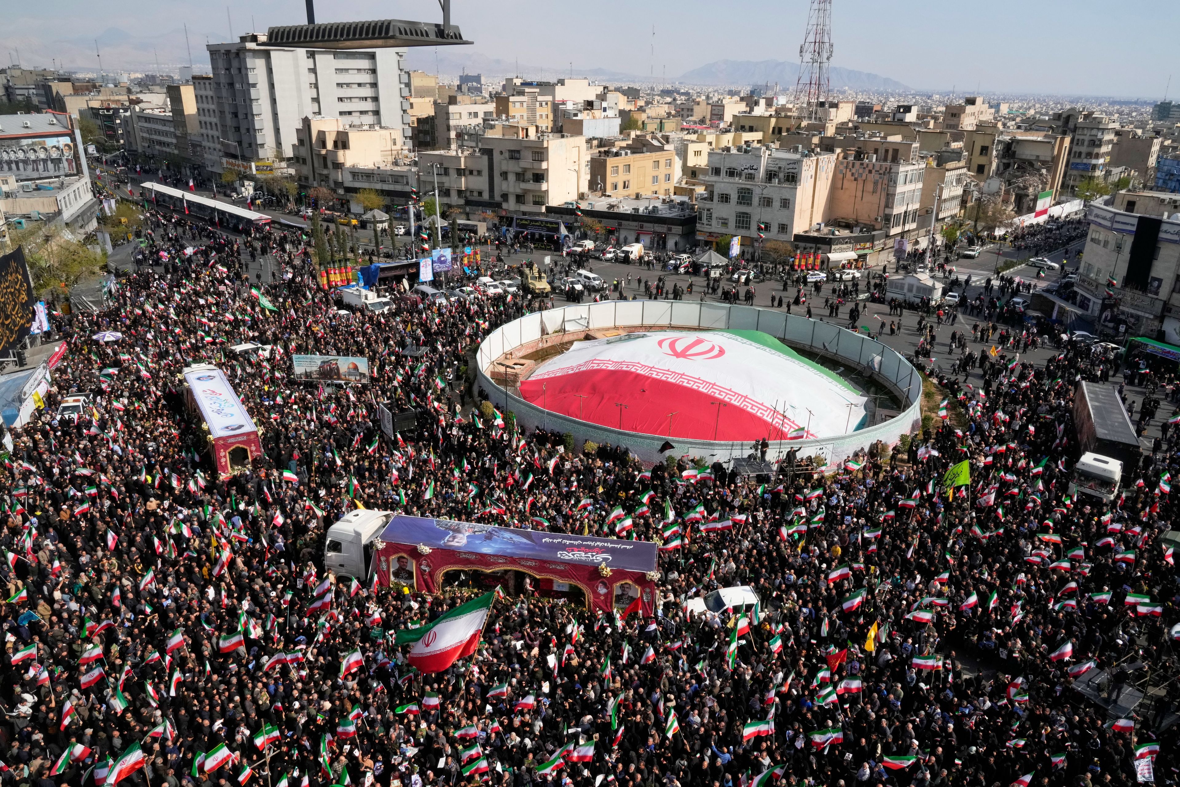 Mourners gather during a funeral procession for Alireza Tangsiri, head of Iran's Islamic Revolutionary Guard Corps Navy, and others killed in Israeli strikes in late March, in Tehran, Iran, Wednesday, April 1, 2026. (AP Photo/Vahid Salemi)