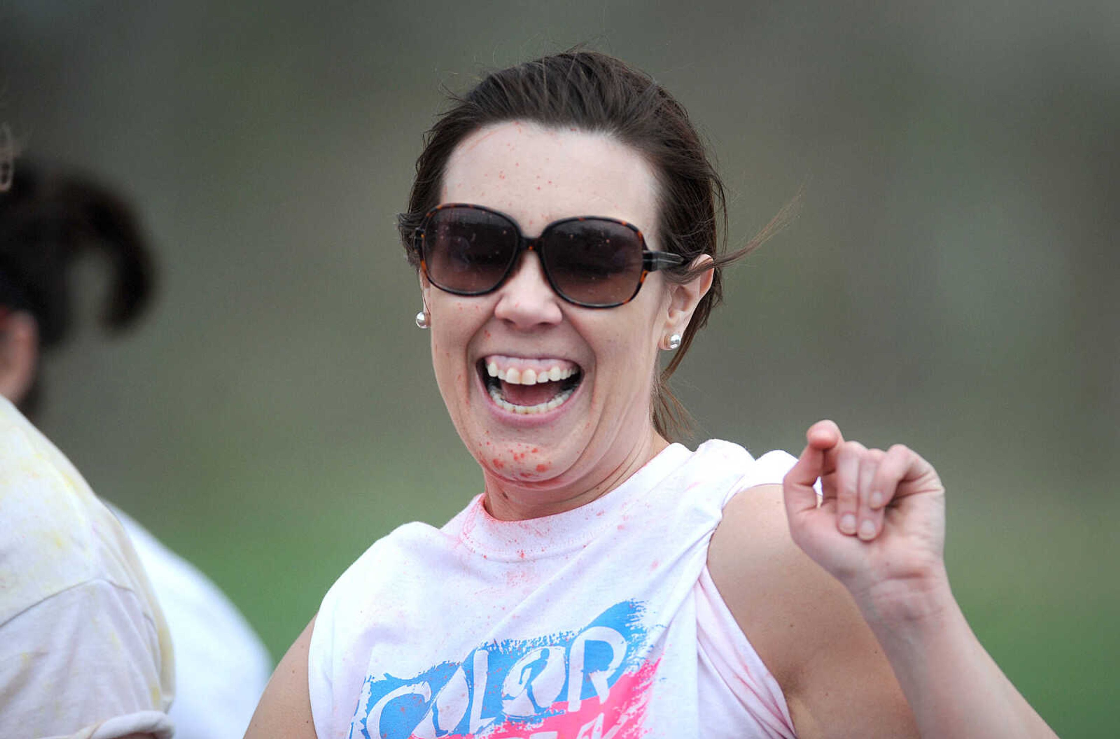 LAURA SIMON ~ lsimon@semissourian.com

Participants in the Color Me Cape 5K are sprayed with orange powder at the first color station on Good Hope Street, Saturday, April 12, 2014, in Cape Girardeau.