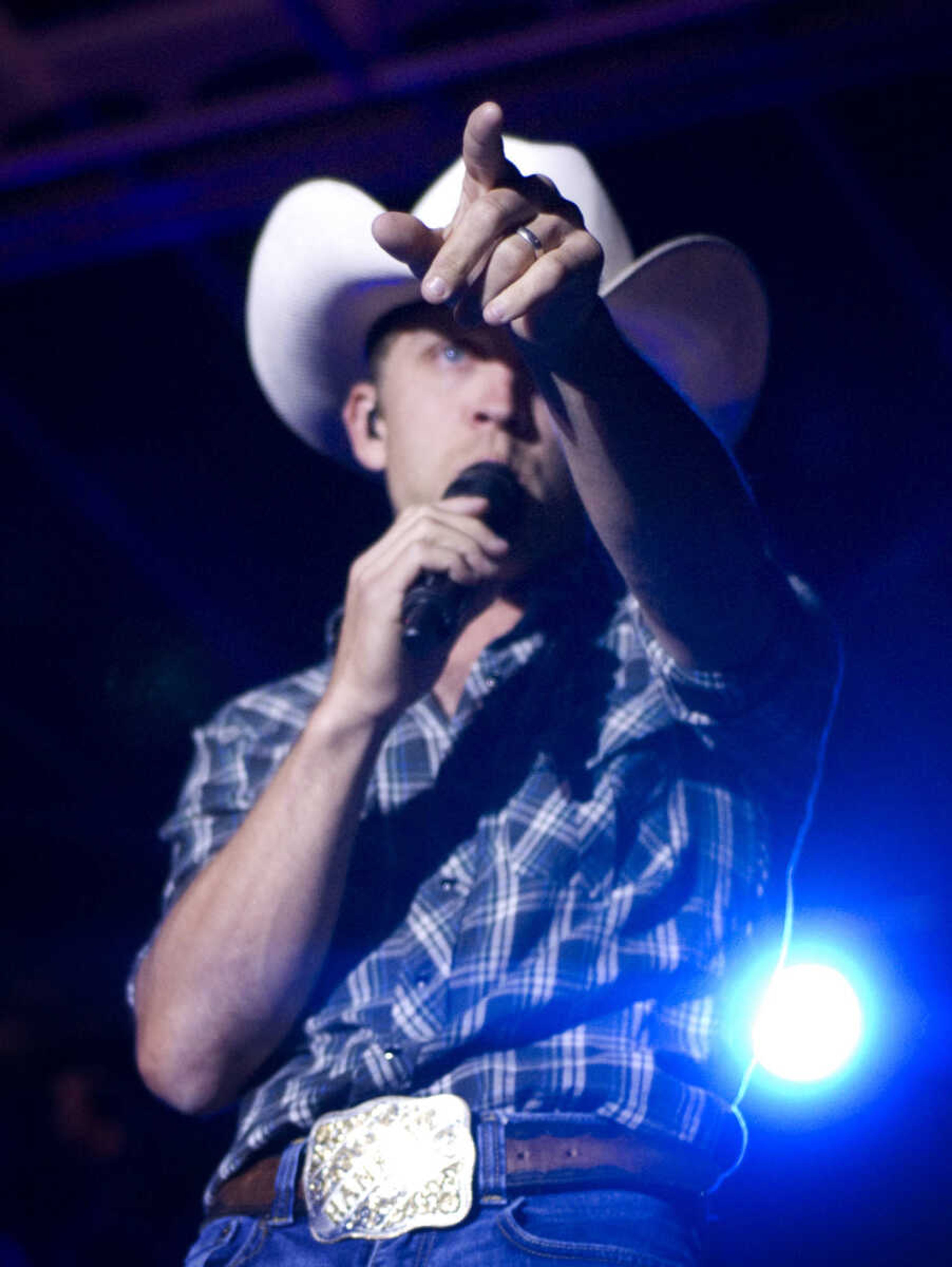 AARON EISENHAUER ~ photos@semissourian.com

Country music star Justin Moore performs for fans on the outdoor stage at Bootheel Harley-Davidson on Friday, July 12, 2013 in Scott City.