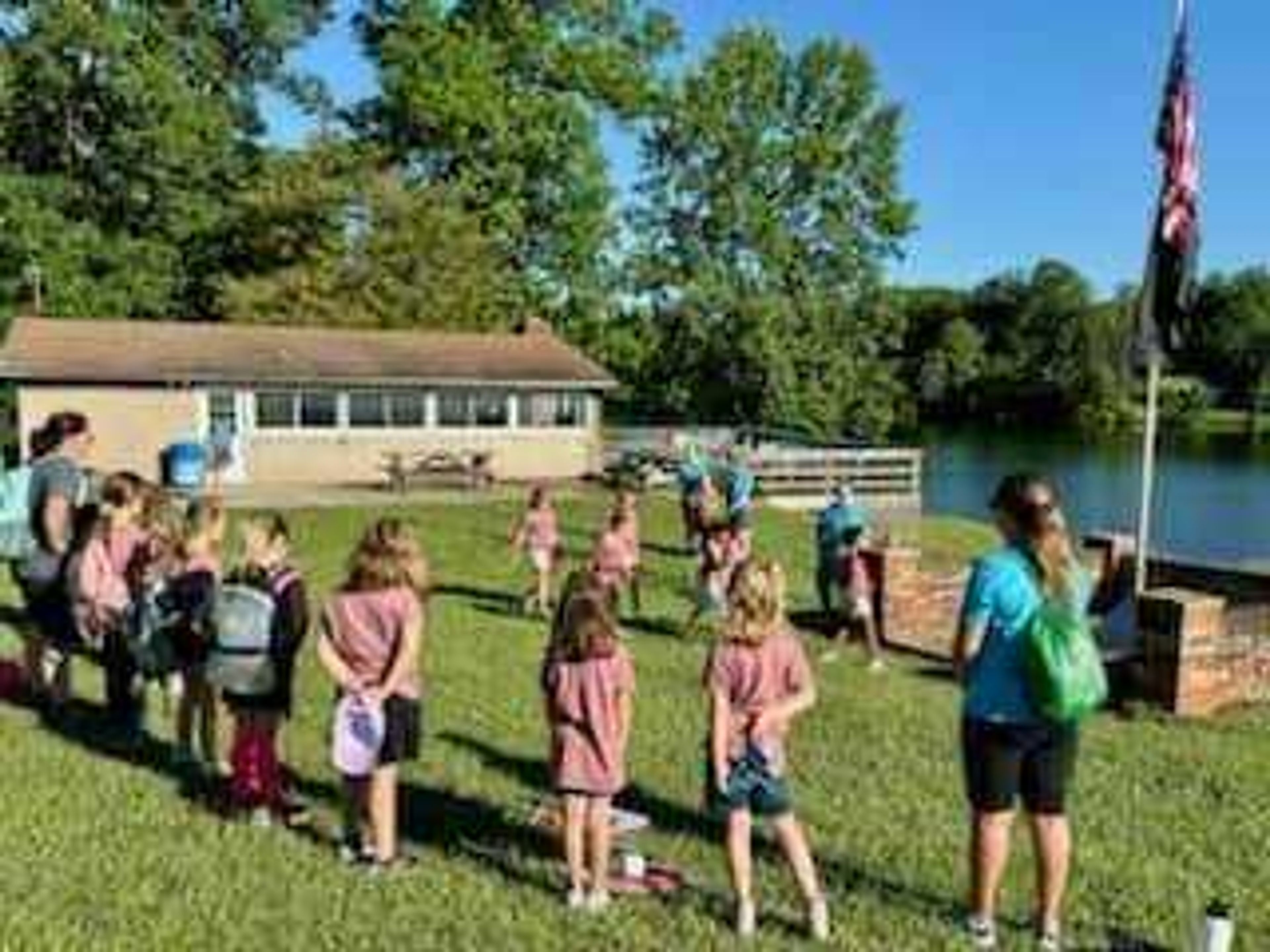 Girl Scouts getting ready for a flag ceremony at Day Camp.