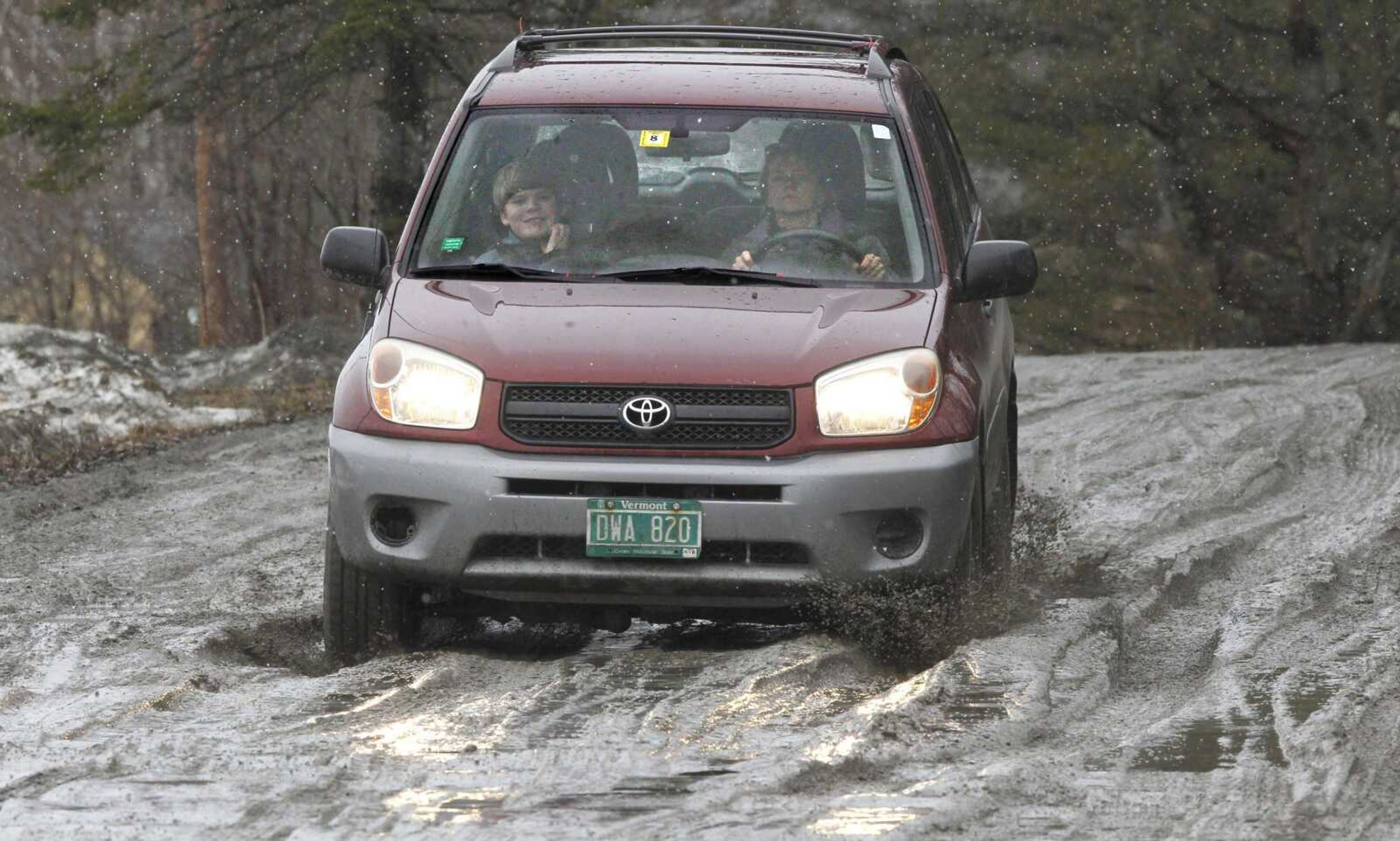 A car navigates muddy roads Tuesday in Calais, Vt. (Toby Talbot ~ Associated Press)