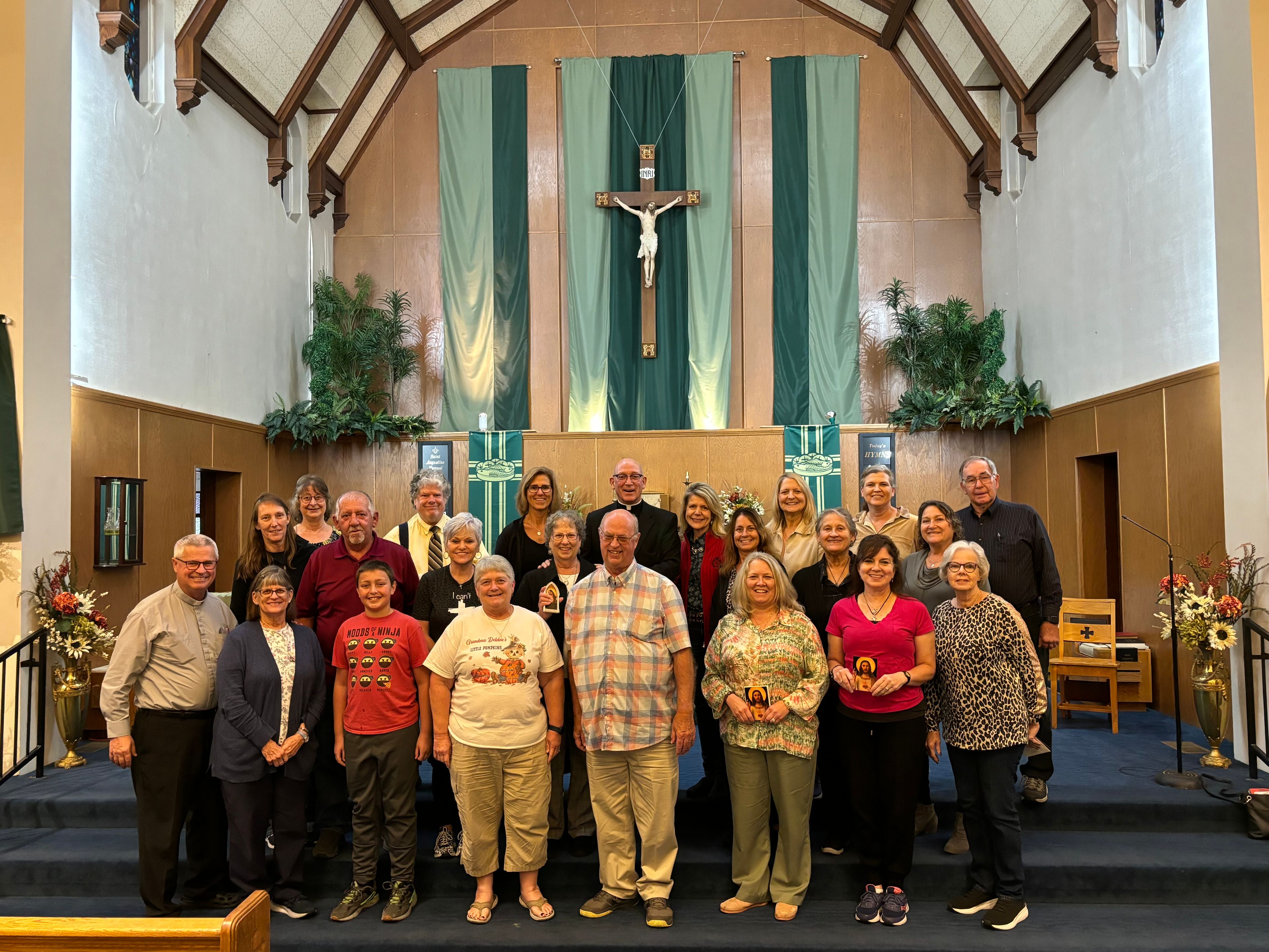 After the presentation of the Sacred Heart pictures from Bishop Edward Rice to the pilgrims, everyone gathered to take a picture at Sacred Heart Parish in Poplar Bluff, Missouri. Pictured left to right are: front row-Deacon Al & Carol Stoverink, Isaac Bremer, Debbie Gaines, David Eftink, Milissa Eggimann, Ruth Ann Hester & Darlene Margrabe. Second row-Stephanie & Curtis Weidenbenner, Jill Pinkston, Doris Eftink, Carla Glaus, Polly Mungle, & Sue Wibbenmeyer. Back row-Joyce Luten, David Coe, Tammy Bean, Bishop Edward Rice, Ann Yuede, Jane Oehl, Tammi Asmus, and Joe Sander.