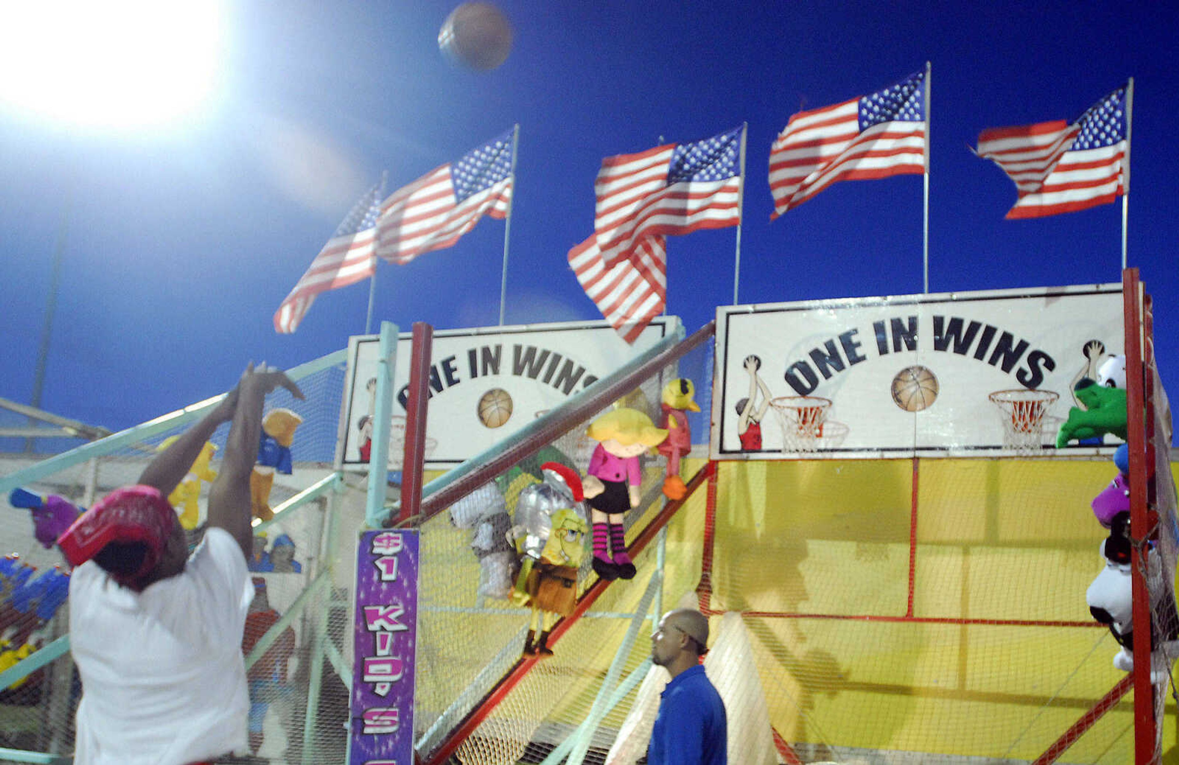 LAURA SIMON~lsimon@semissourian.com
A patron takes a shot at the "One Shot Wins" game Thursday, September 16, 2010 during the 155th Annual SEMO District Fair.