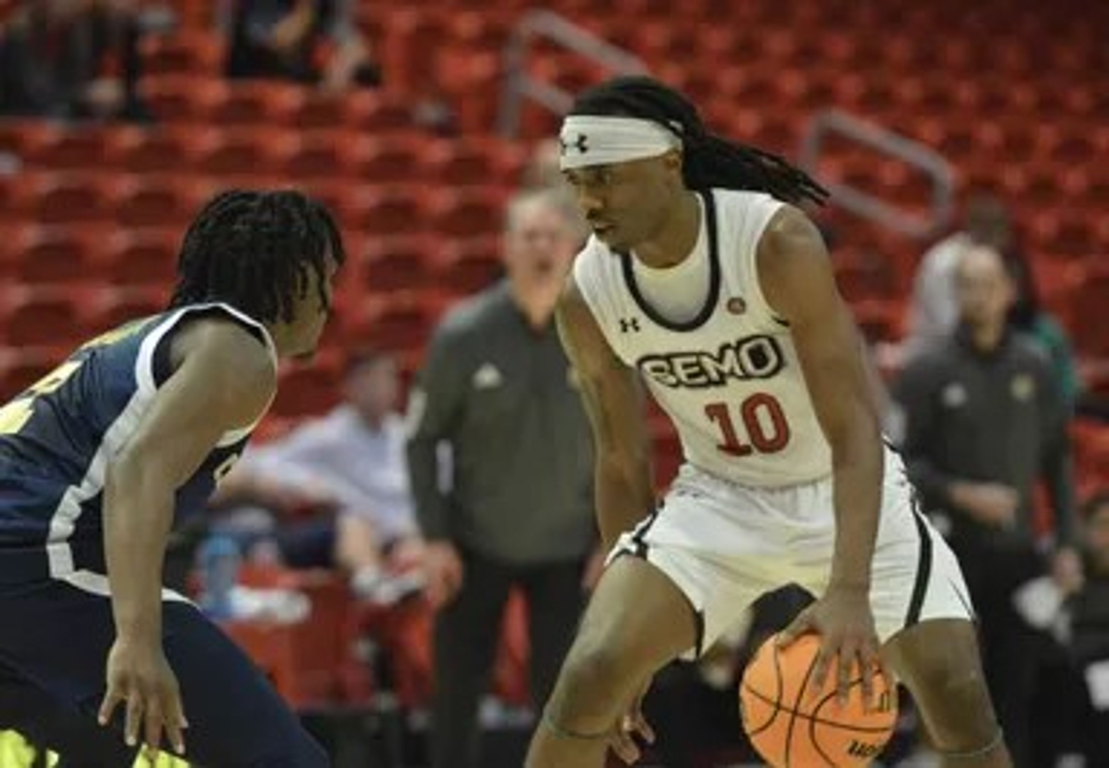 Southeast Missouri State’s Teddy Washington Jr. dribbles the ball in front of a Chattanooga defender Sunday, Nov. 17, at the Show Me Center in Cape Girardeau.