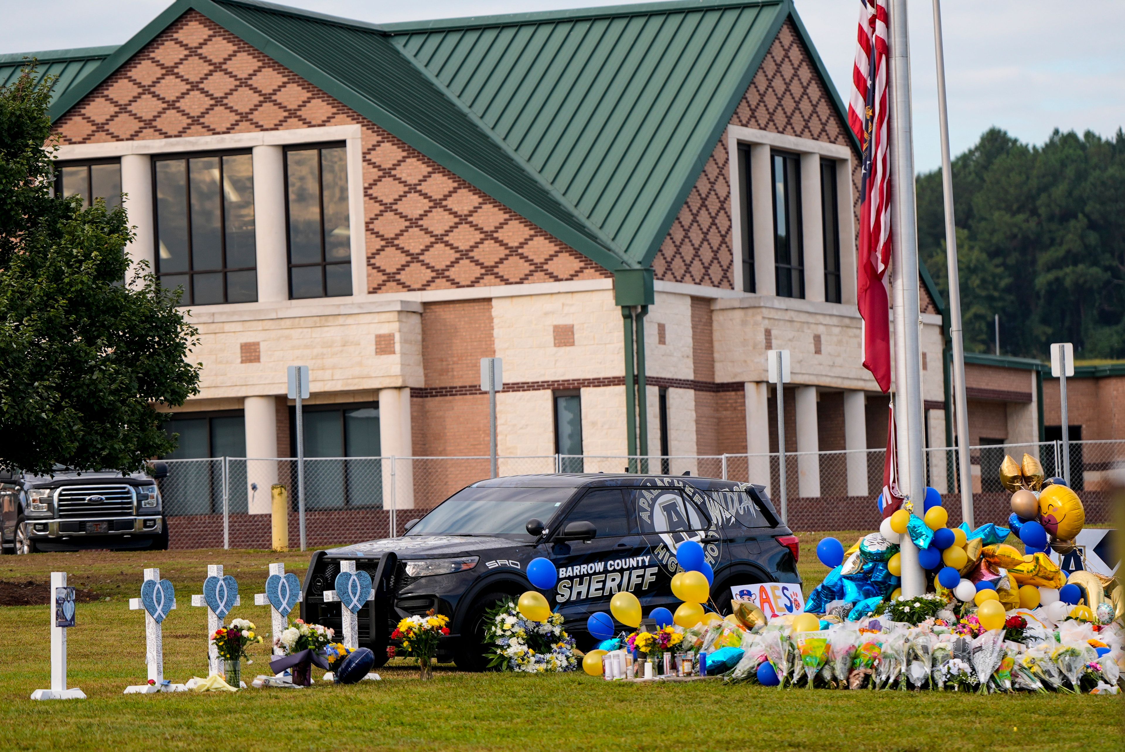 A memorial is seen at Apalachee High School after the Wednesday school shooting, Saturday, Sept. 7, 2024, in Winder, Ga. (AP Photo/Mike Stewart)