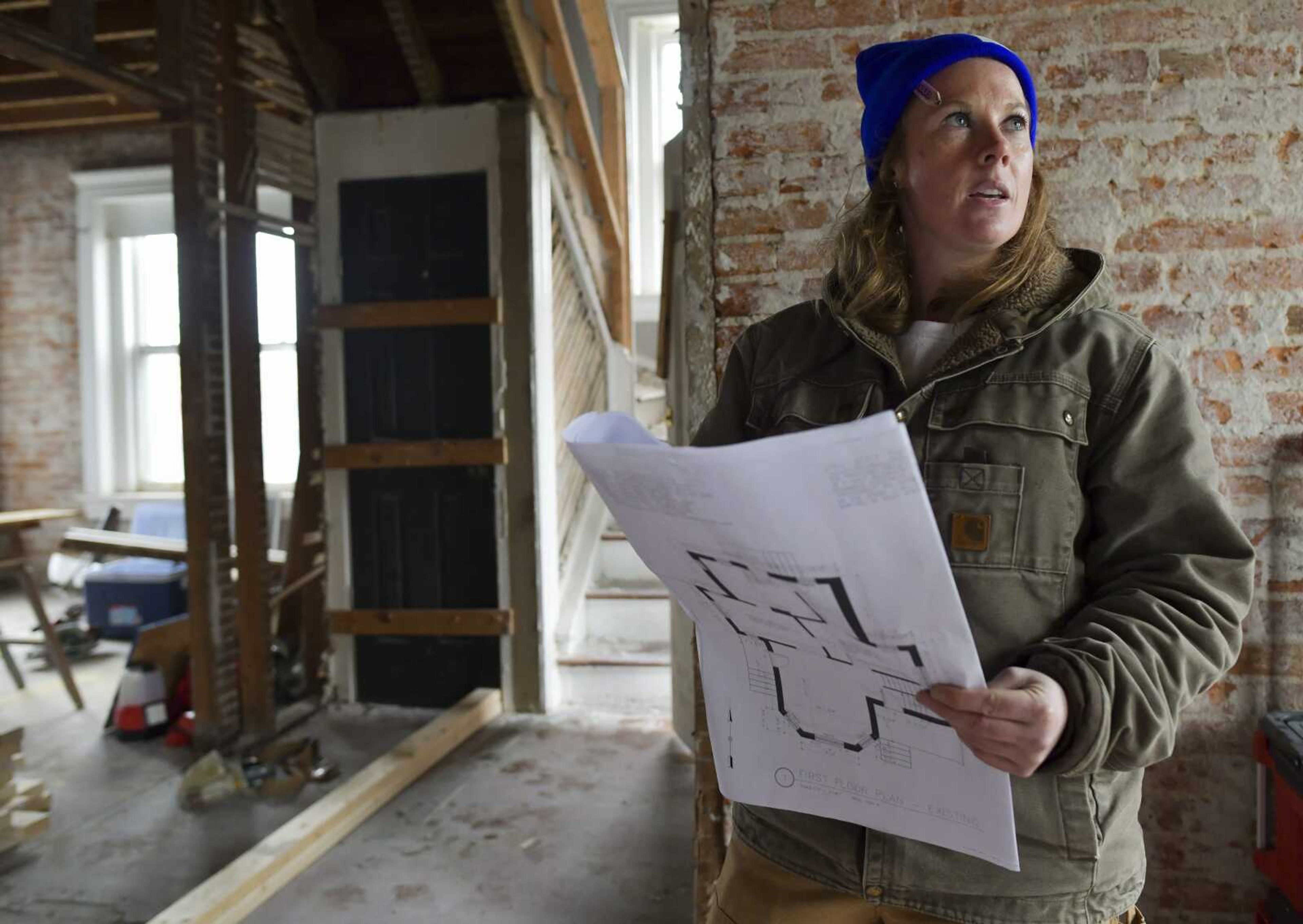 Project manager Jessica Livingston gives an overview of the ongoing renovations at 802 William St. on March 11 in Cape Girardeau. Once rennovated, the location will house a life recovery program for people at risk of experiencing homelessness.